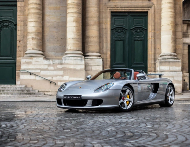 Silver Porsche Carrera GT photographed on a cobbled street for L’Art de l’Automobile.