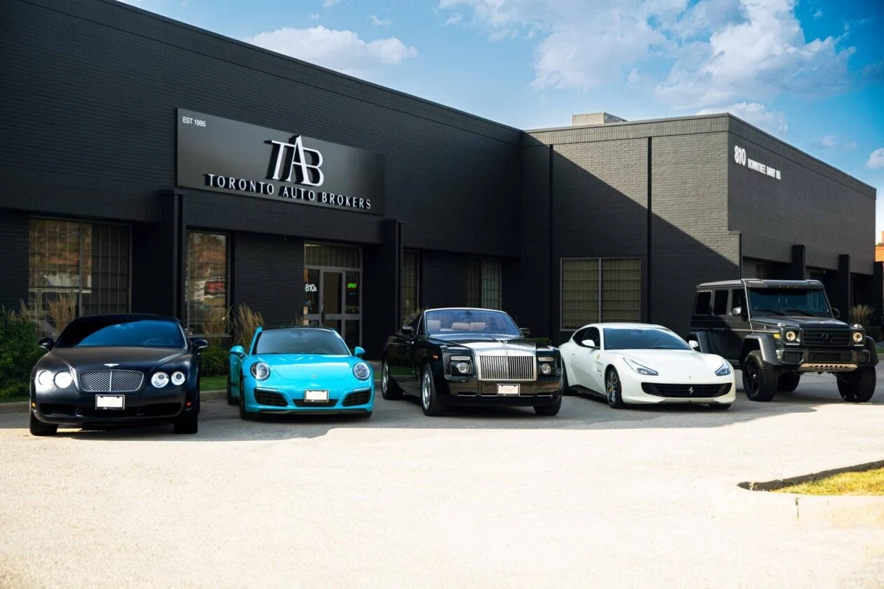 Toronto Auto Brokers dealership building in Vaughan, Ontario, seen from outside.