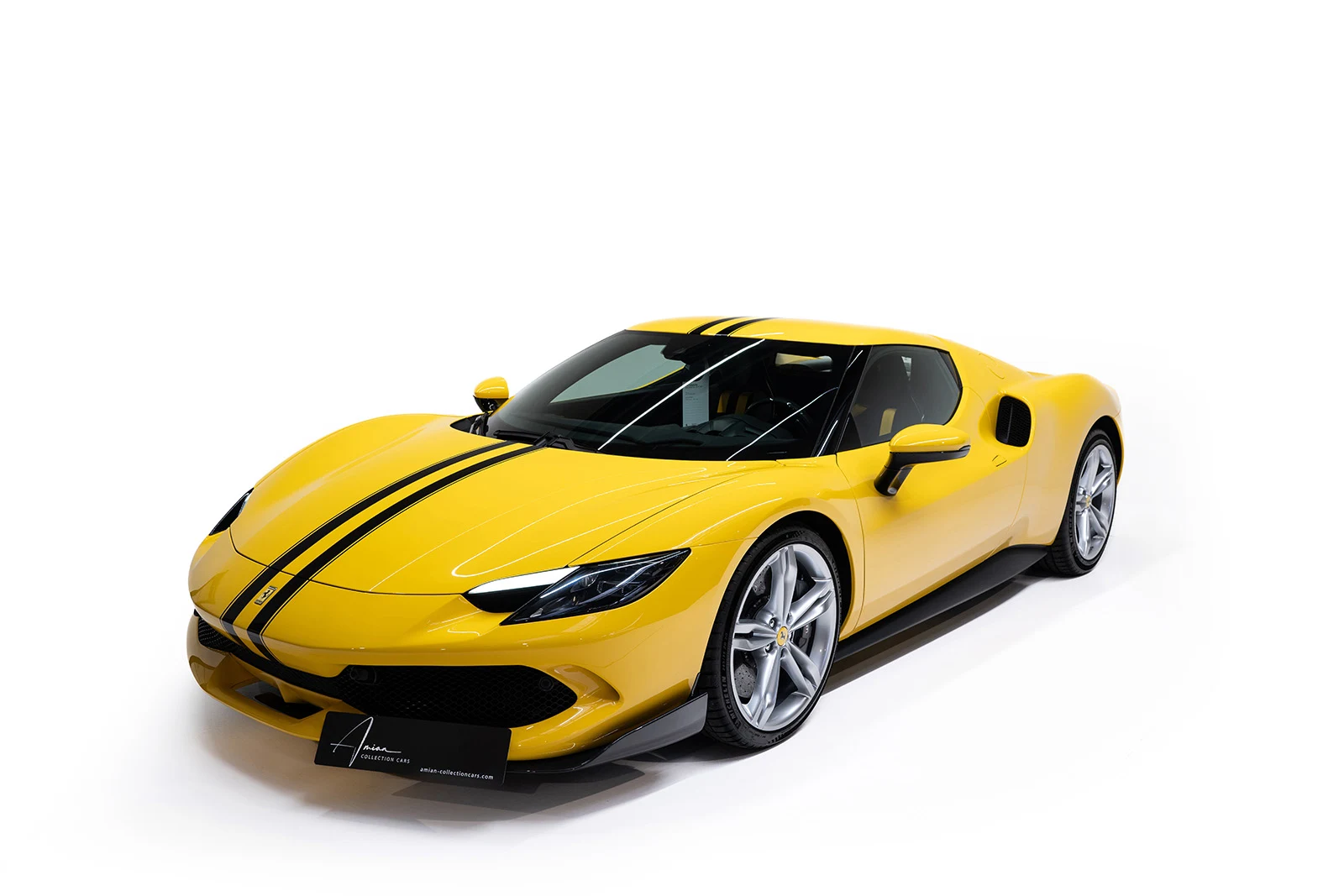 Yellow Ferrari 296 GTB with black stripes, full front three-quarter view