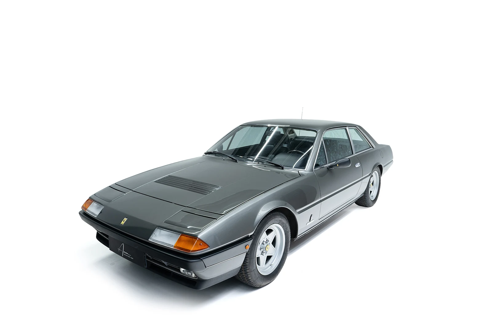 Gray Ferrari 400i, full front three-quarter view