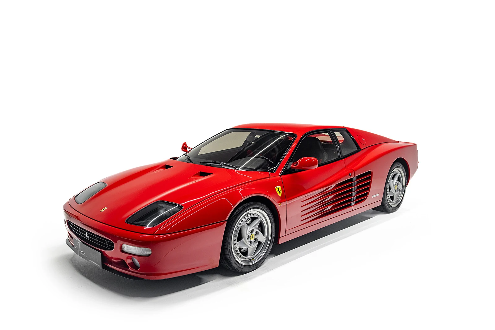 Red Ferrari F512 M, full front three-quarter view