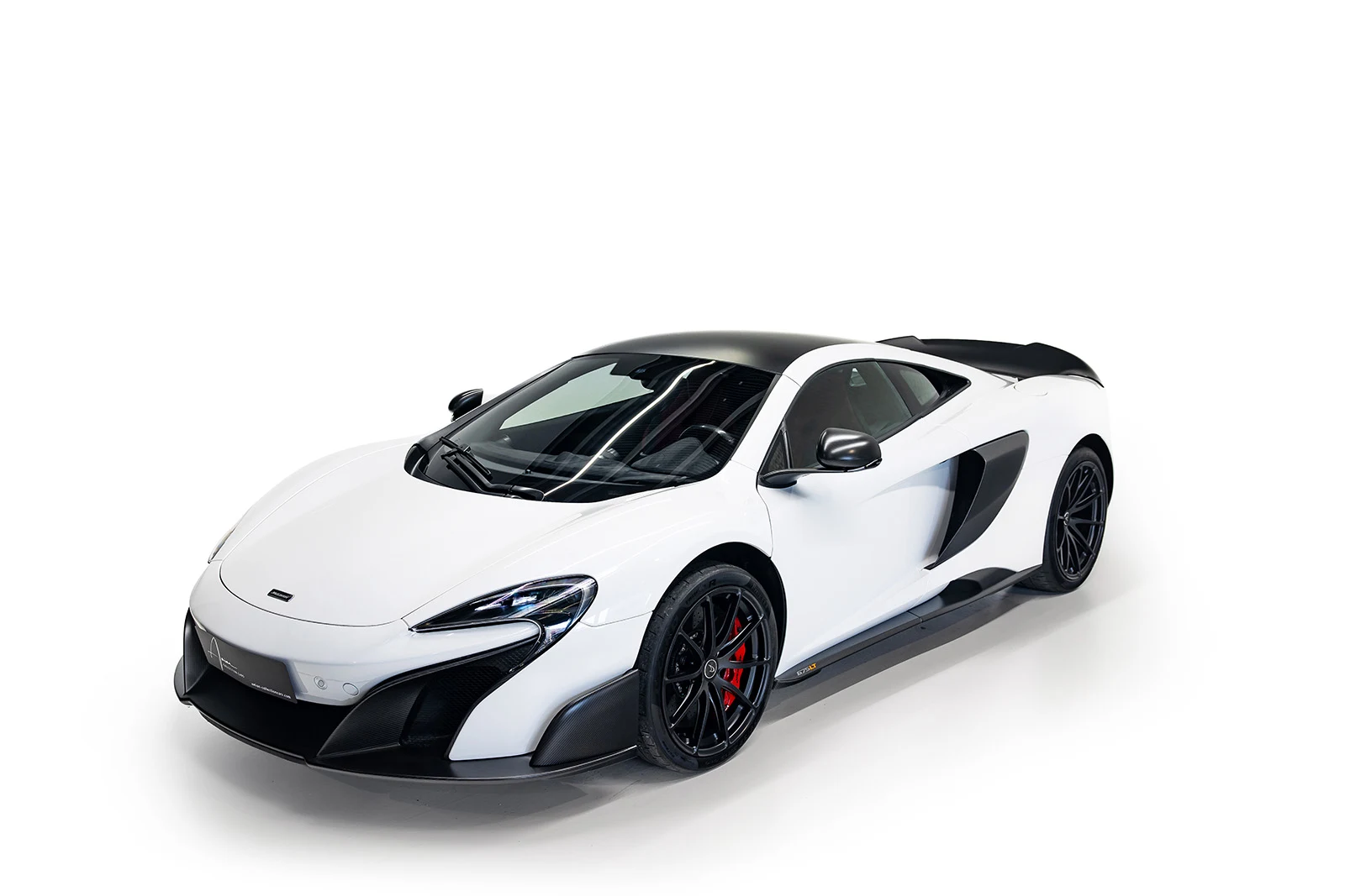 White McLaren 675LT, full front three-quarter view