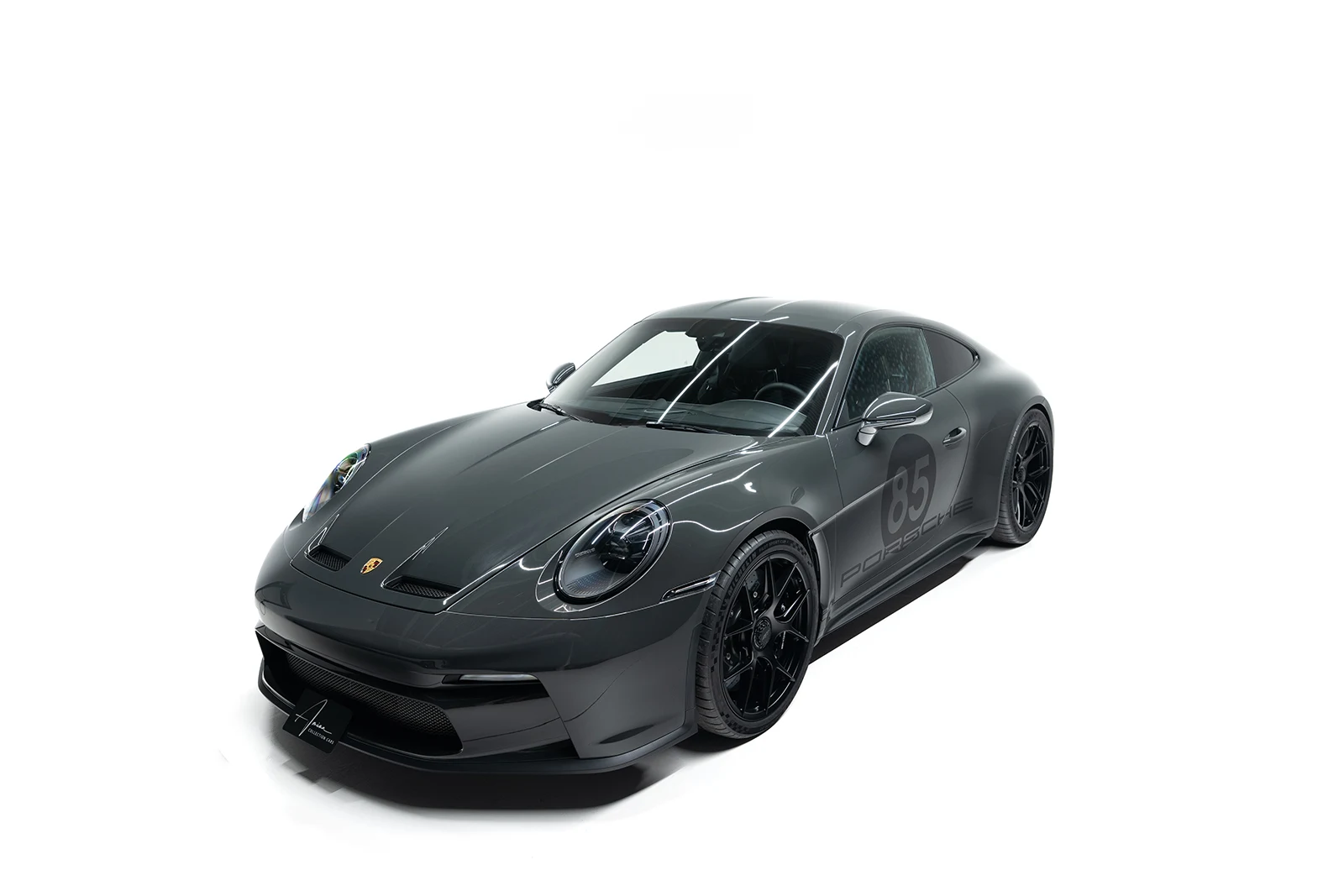 Dark gray Porsche 911 S/T, full front three-quarter view