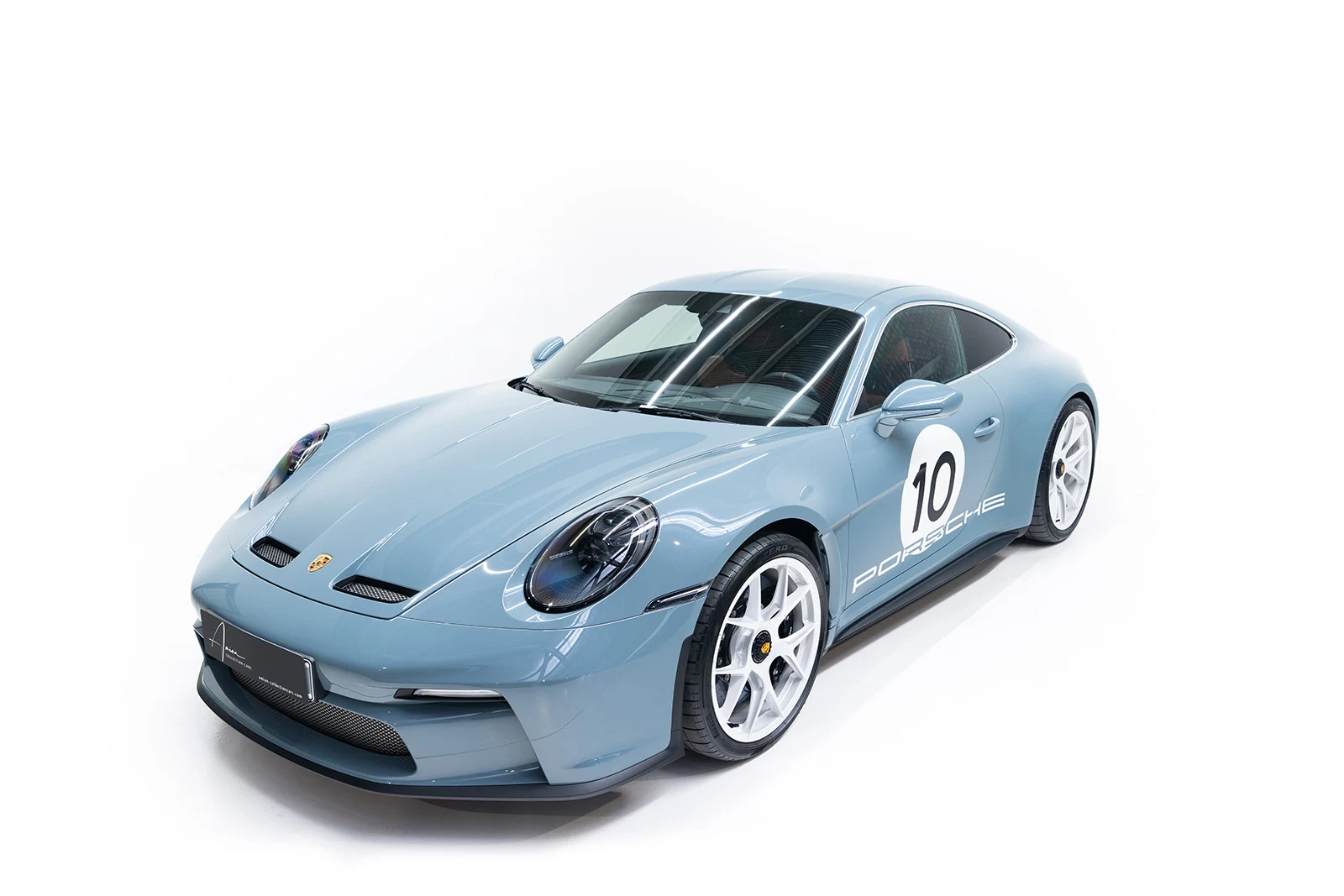 Light blue Porsche 911 S/T with number 10, full front three-quarter view