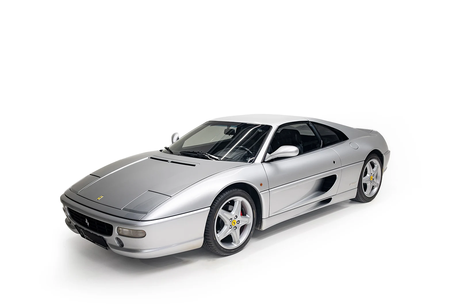 Silver Ferrari F355 GTS, full front three-quarter view