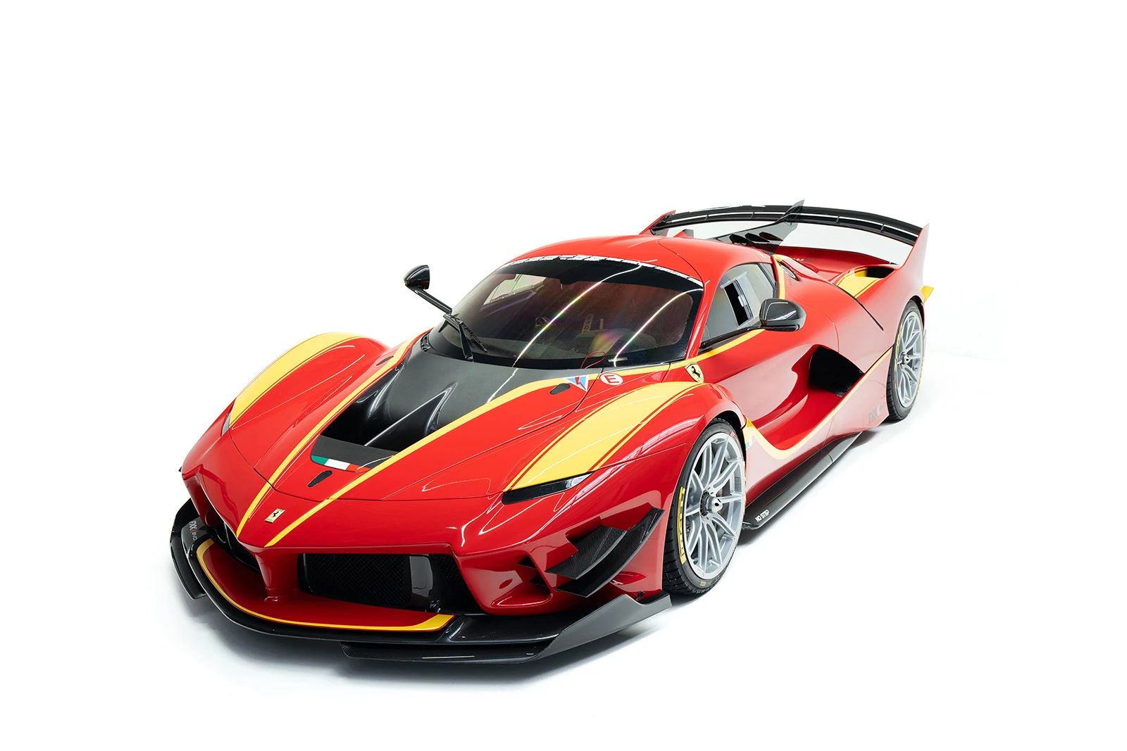 Red and yellow Ferrari FXX-K Evo, full front three-quarter view