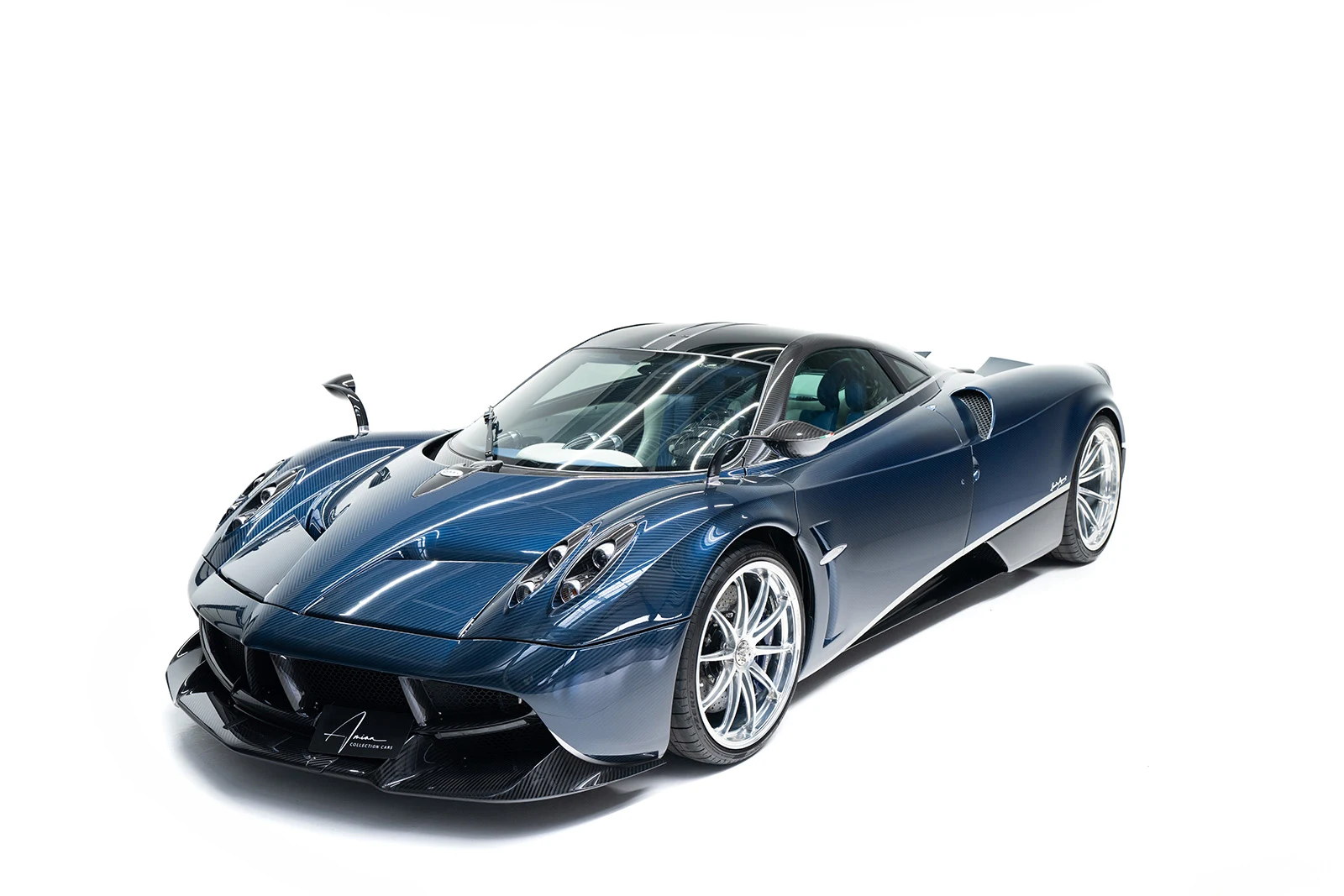 Blue carbon Pagani Huayra, full front three-quarter view