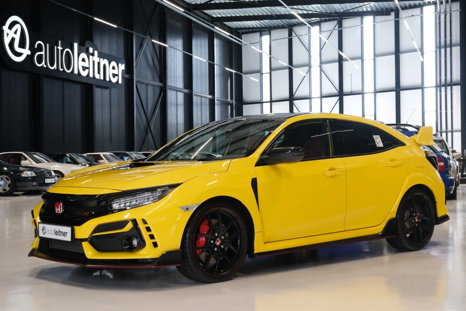 Yellow Honda Civic Type R, full front three-quarter view