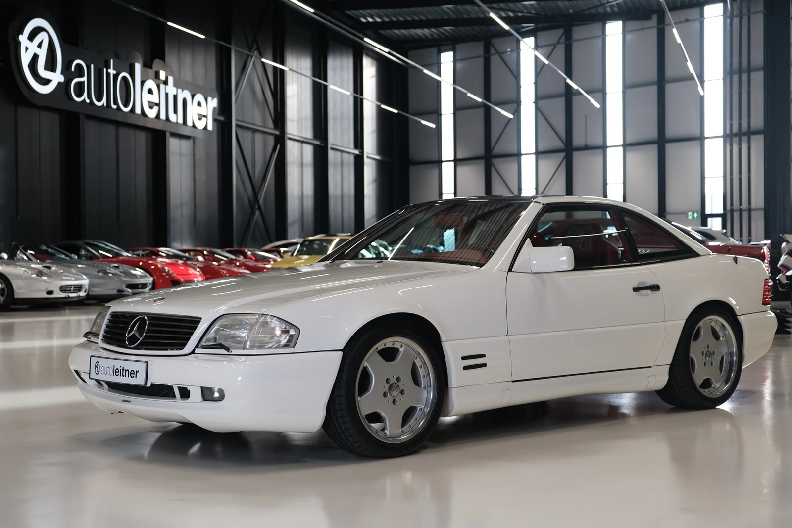 White Mercedes-Benz SL 500, full front three-quarter view