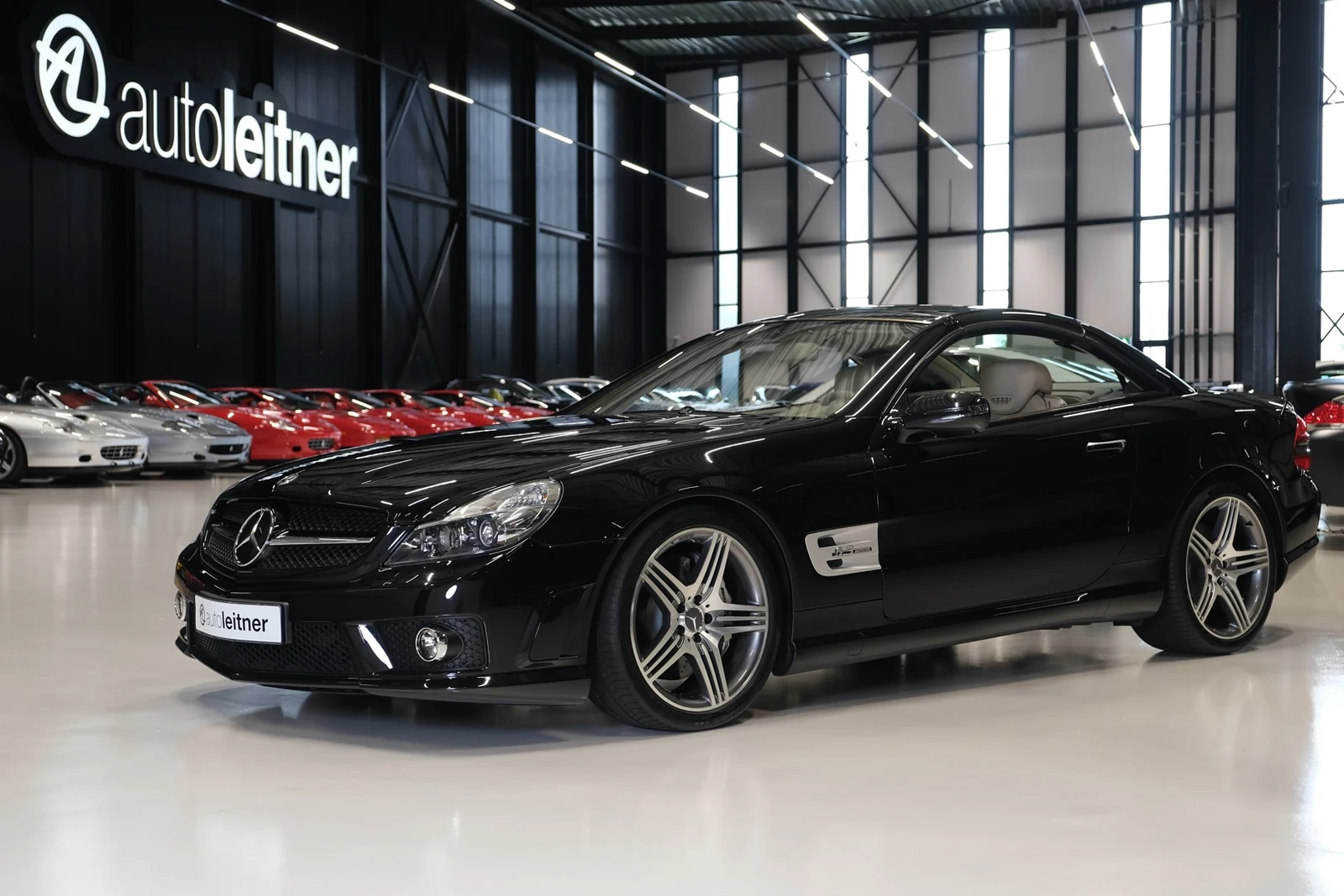 Black Mercedes-AMG SL 63, full front three-quarter view
