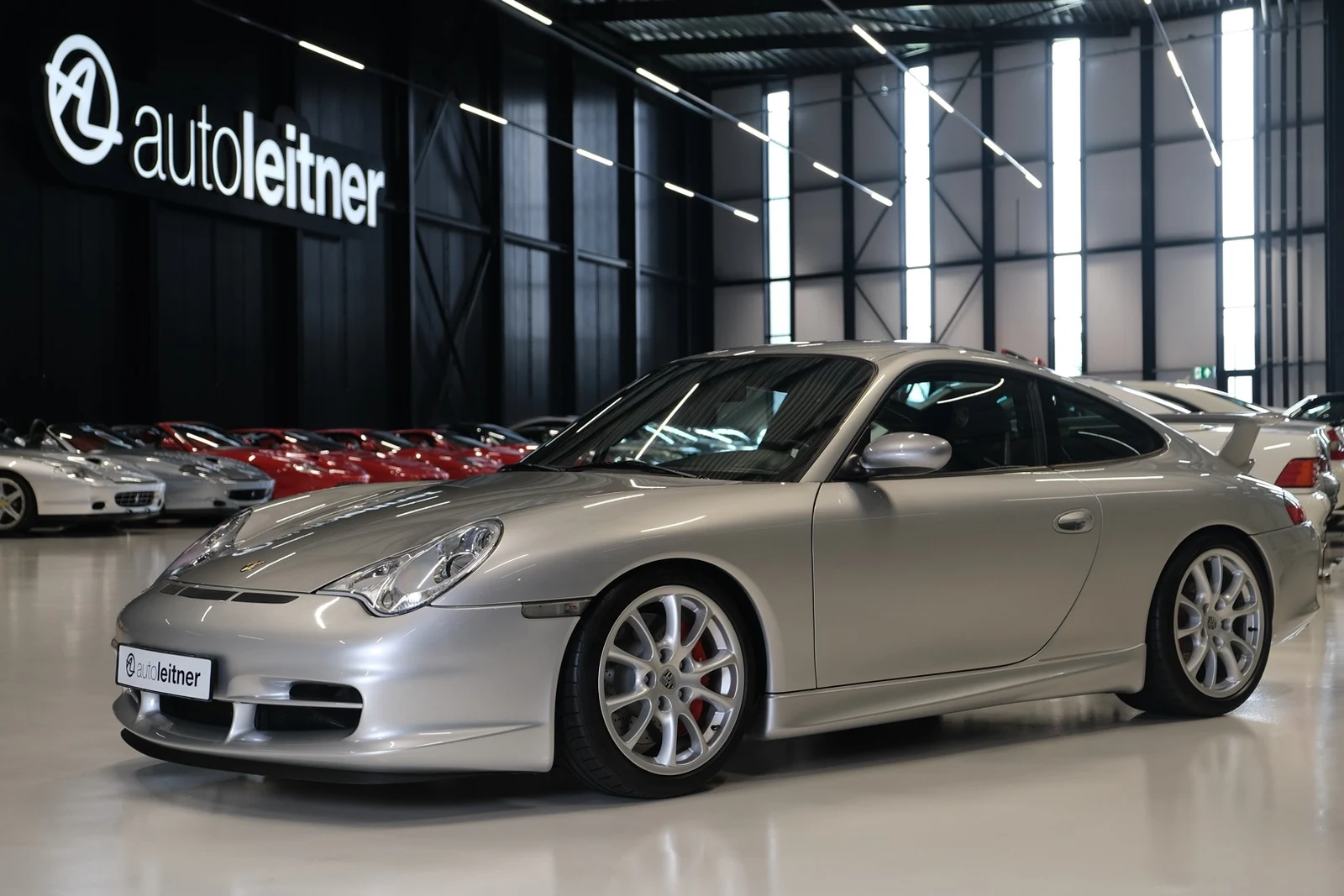 Silver Porsche 911 GT3, full front three-quarter view