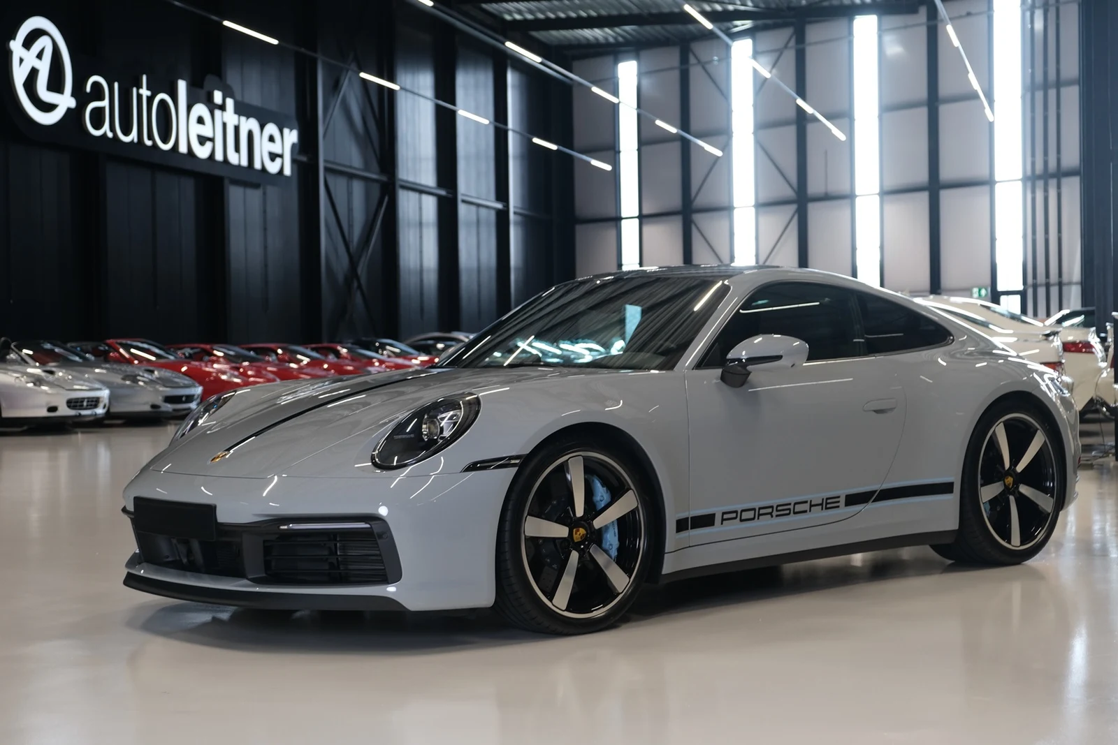 Gray Porsche 911 Carrera 4S, full front three-quarter view