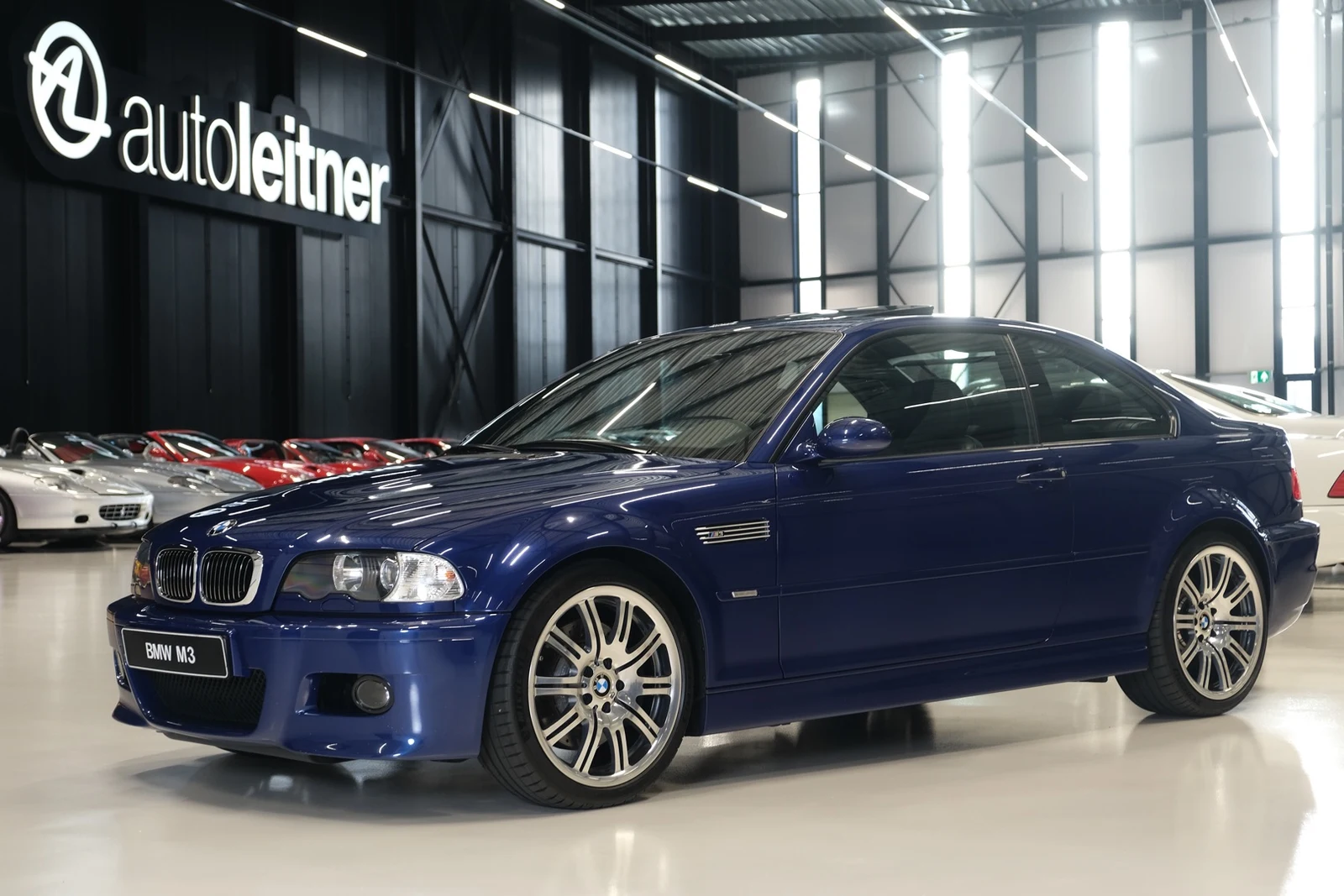 Blue BMW M3 CS, full front three-quarter view