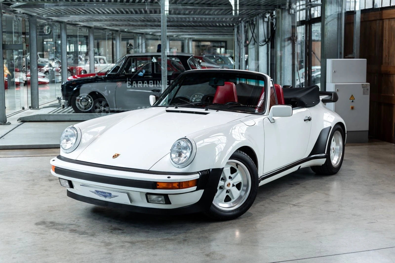 White Porsche 911 Turbo Cabriolet, full front three-quarter view