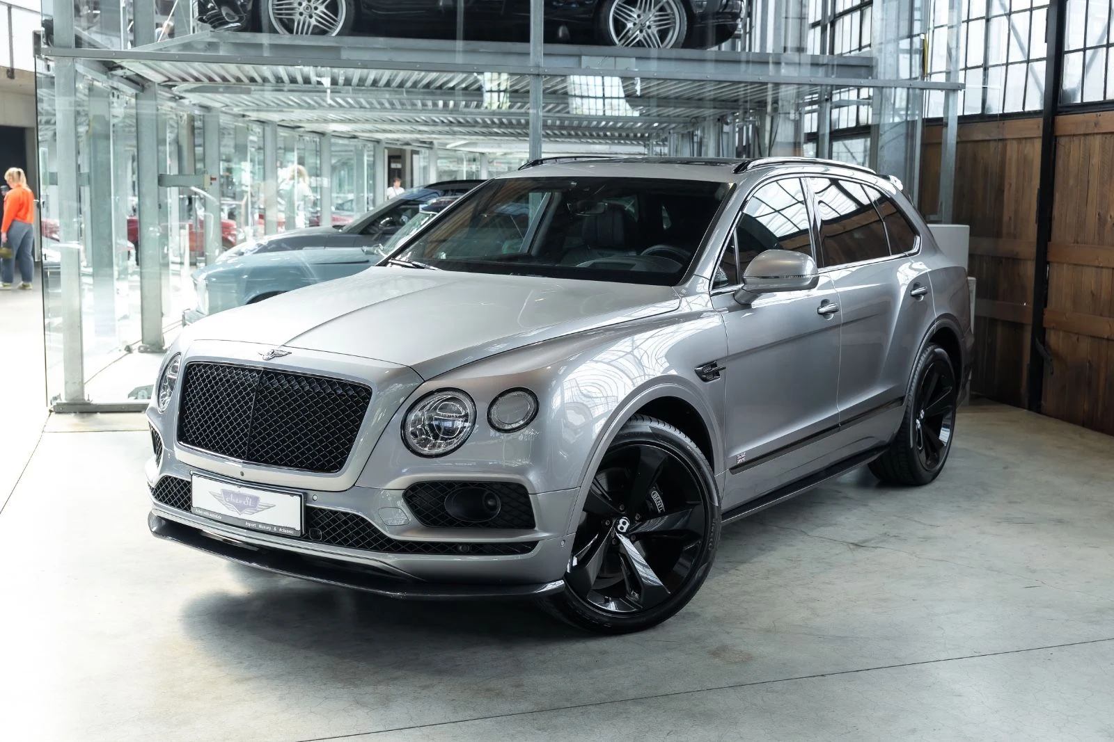 Gray Bentley Bentayga, full front three-quarter view