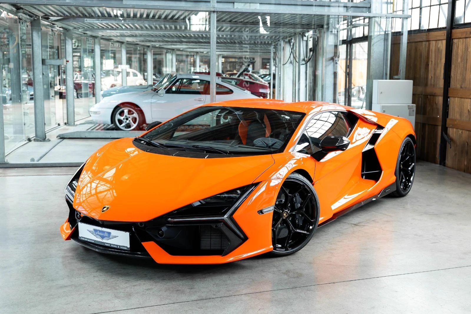 Orange Lamborghini Revuelto, full front three-quarter view