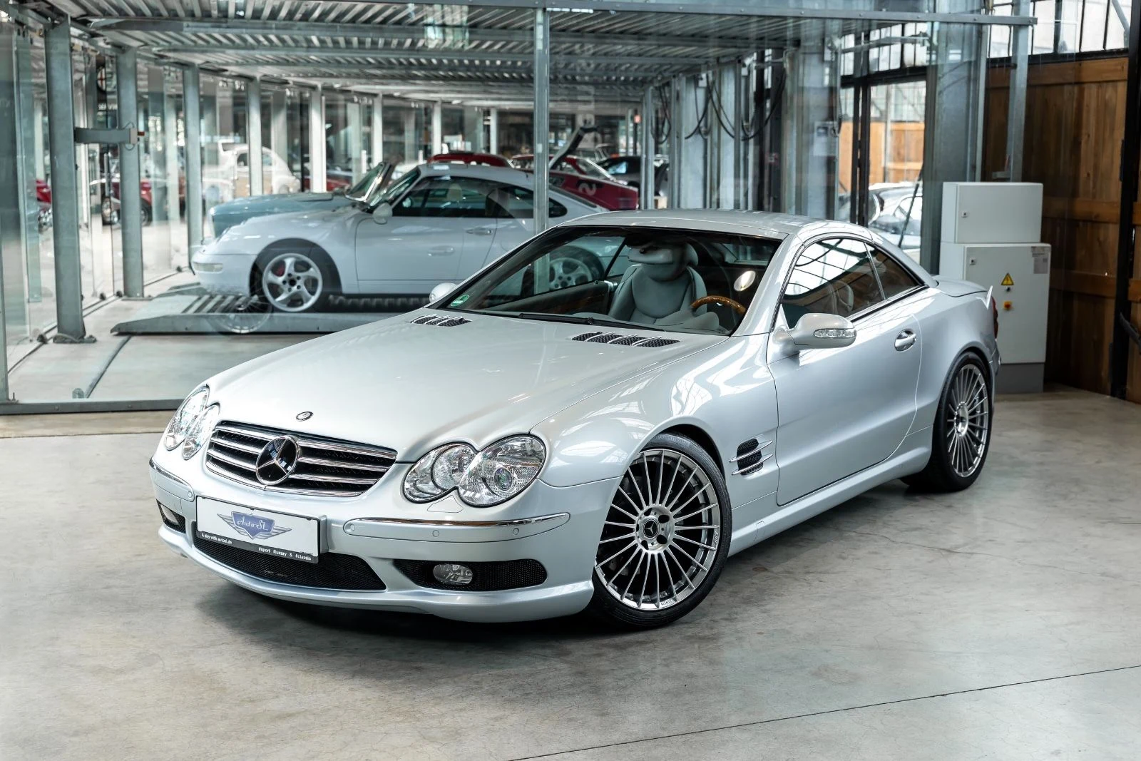 Silver Mercedes-Benz SL 500, full front three-quarter view