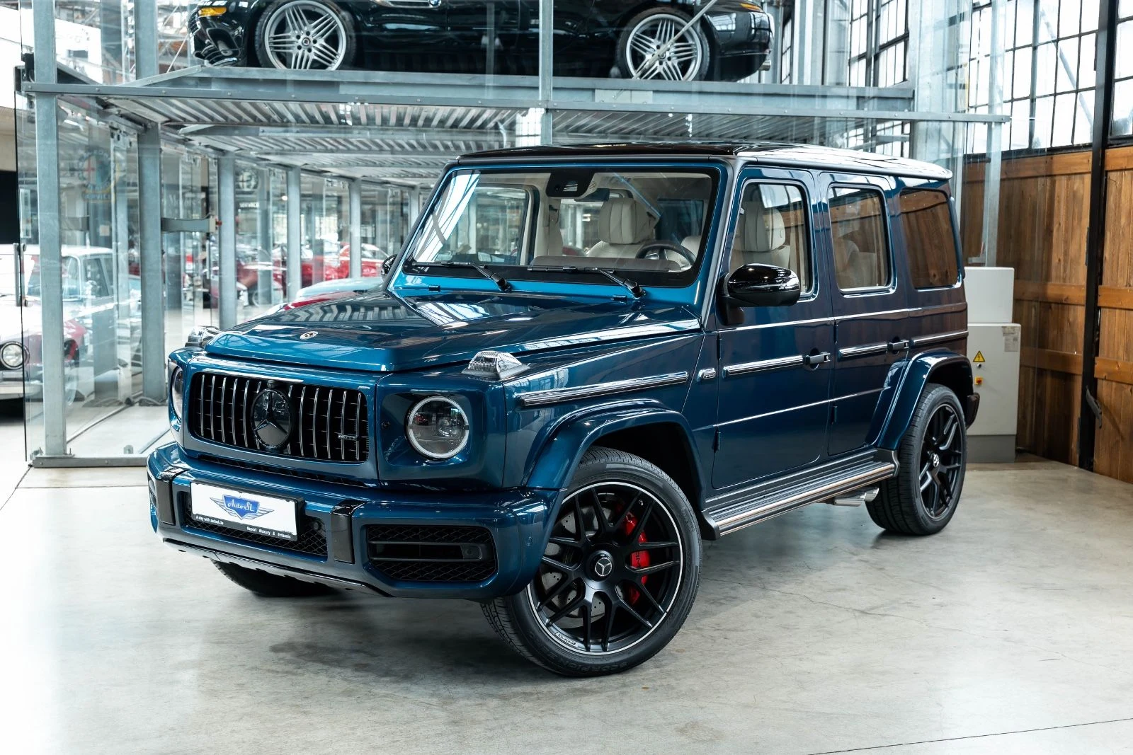 Blue Mercedes-AMG G 63, full front three-quarter view