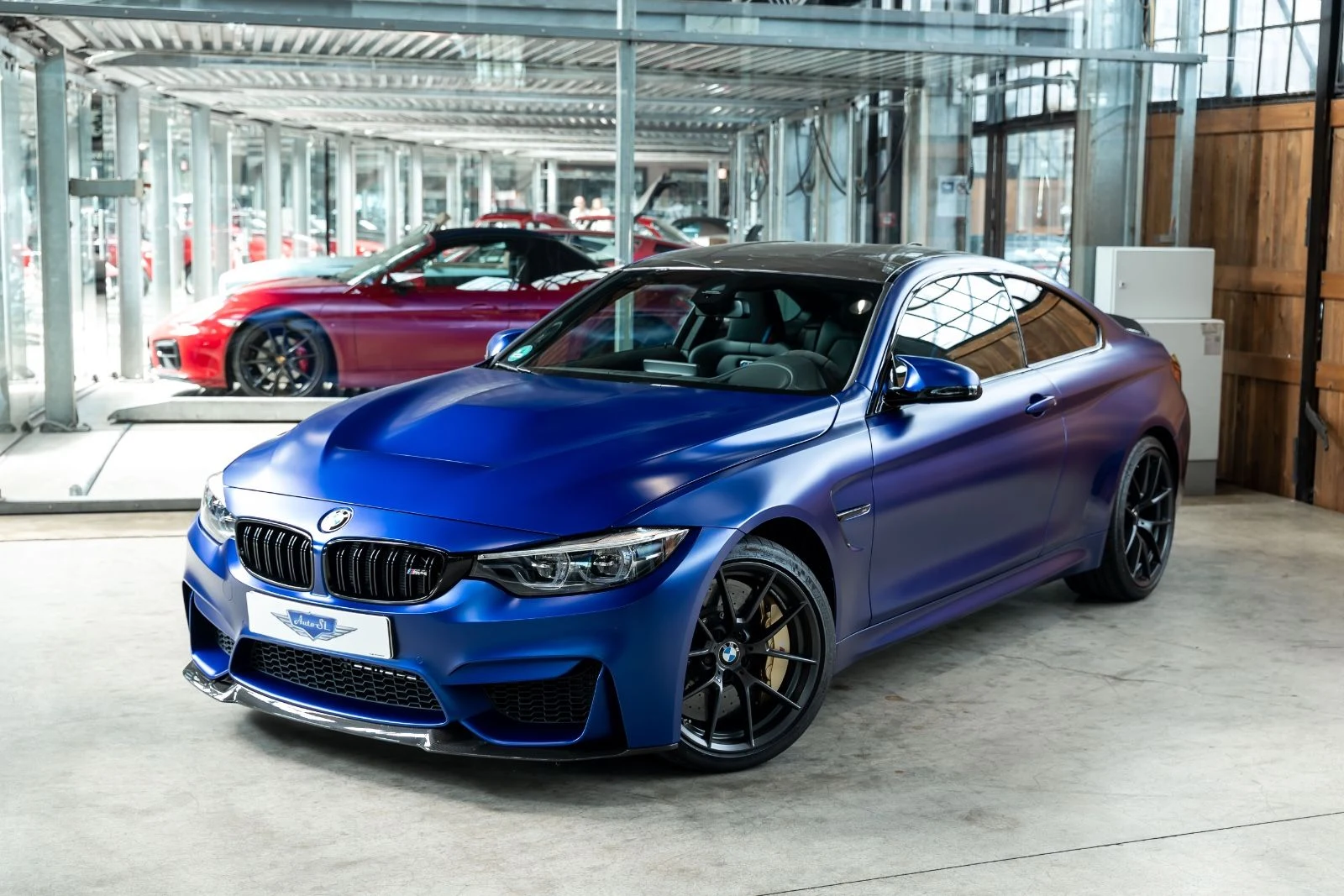 Blue BMW M4 CS, full front three-quarter view