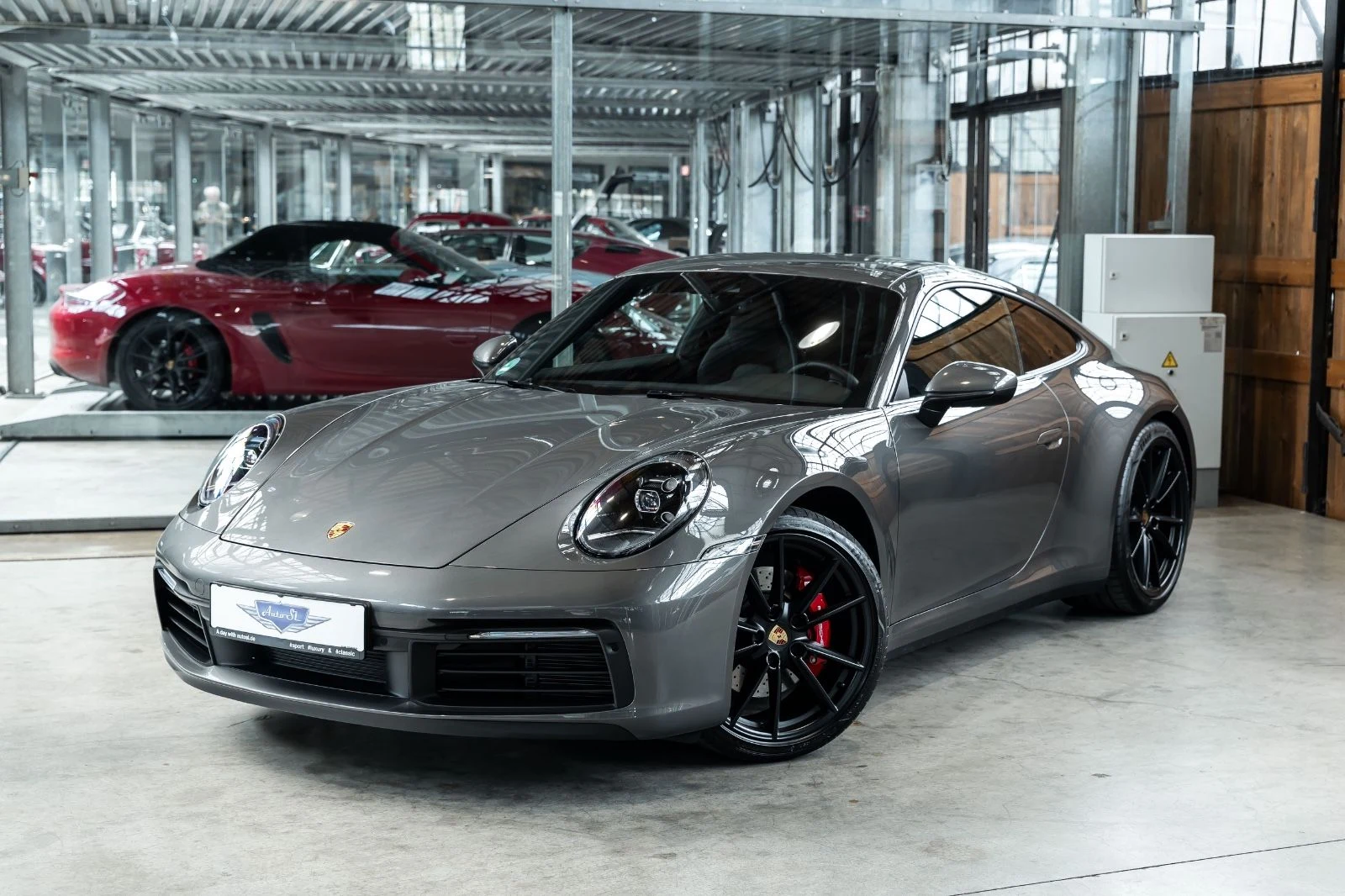 Gray Porsche 911 Carrera S, full front three-quarter view