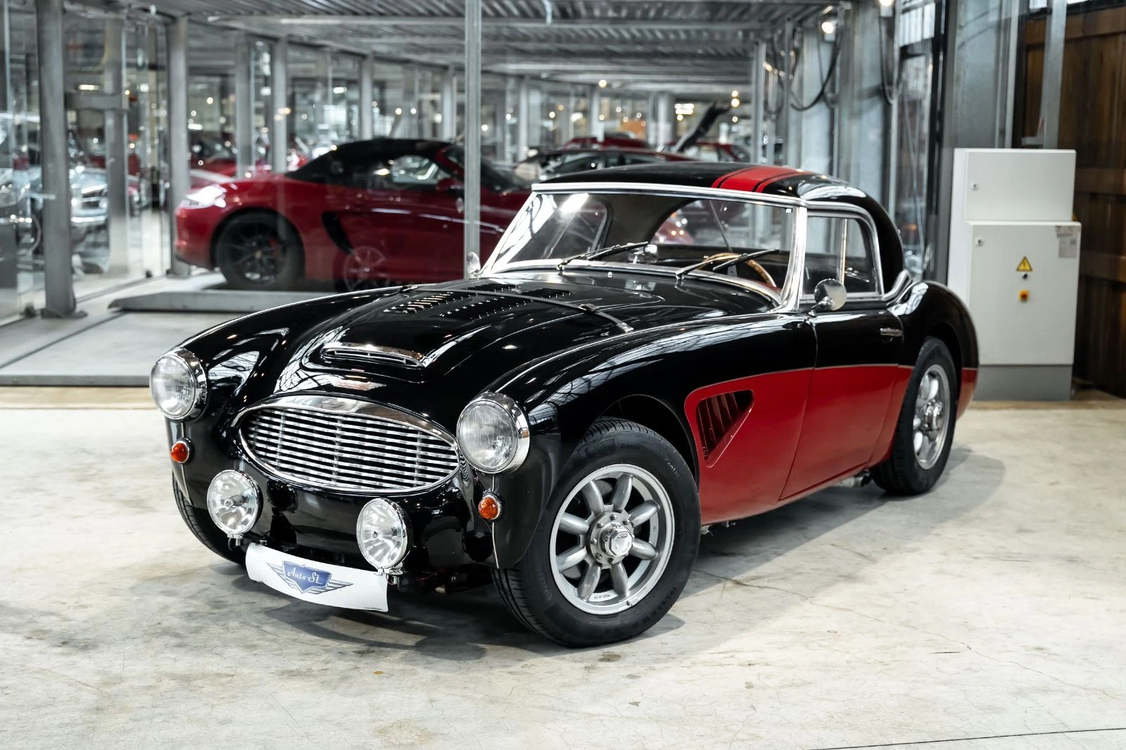 Black and red Austin-Healey 100/6, full front three-quarter view