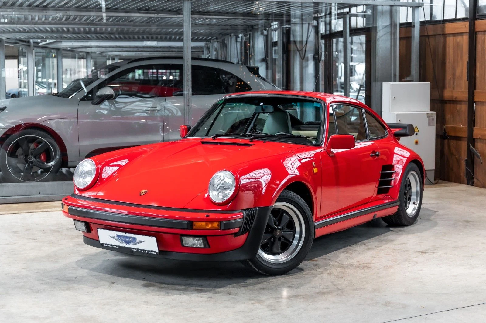 Red Porsche 911 Turbo 930, full front three-quarter view