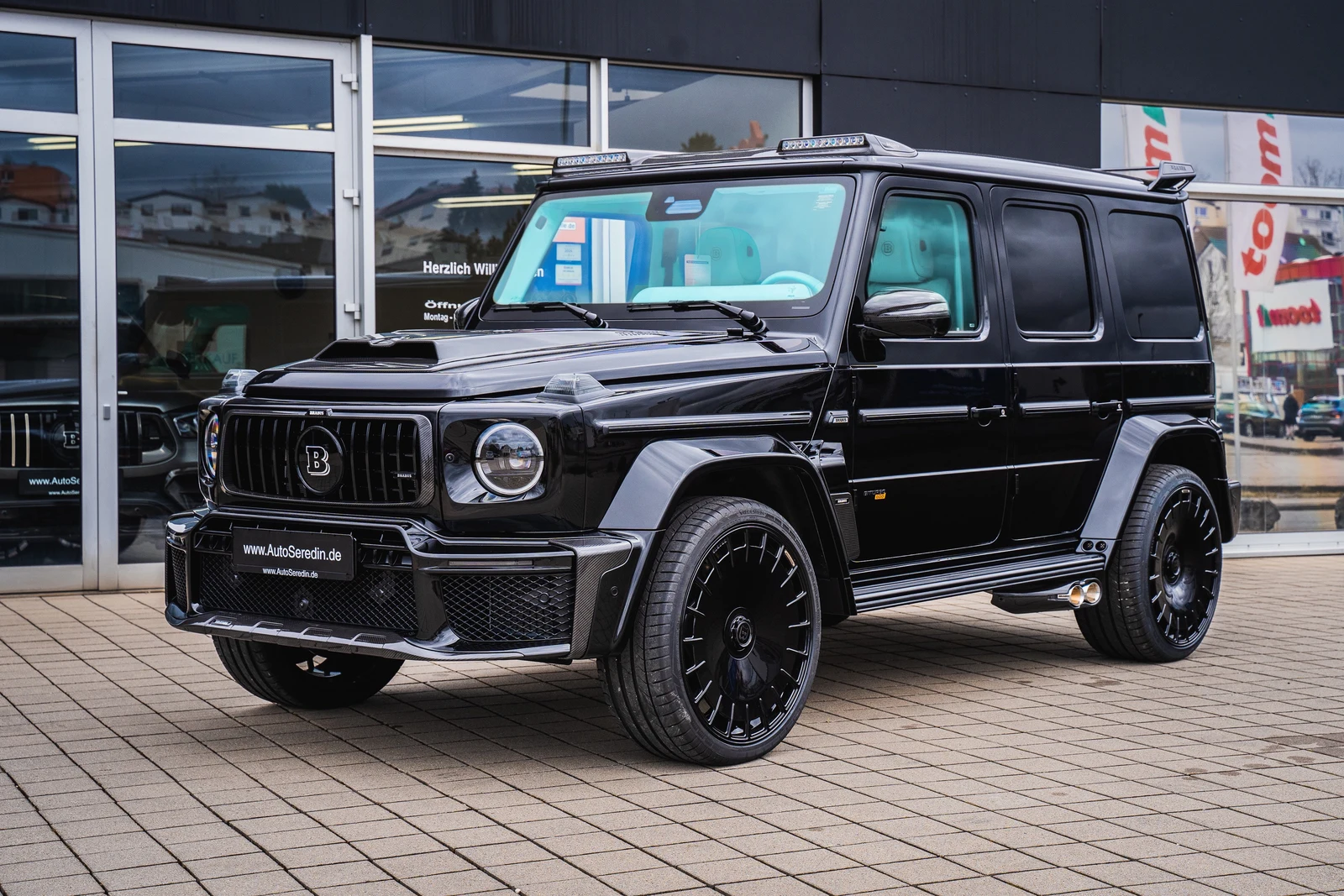 Black BRABUS G 800 Widestar, full front three-quarter view