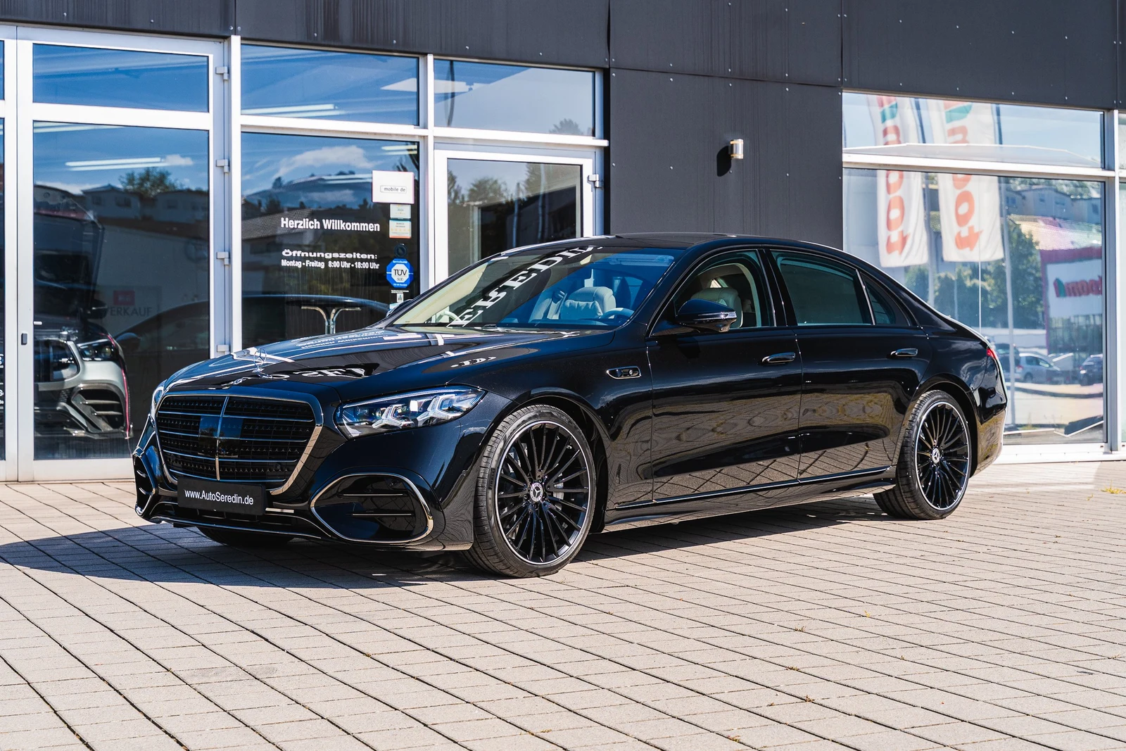 Black Mercedes-Benz S 580, full front three-quarter view