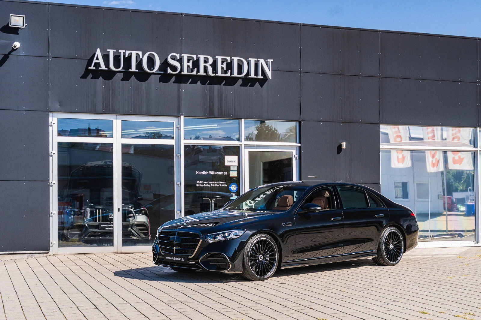 Black Mercedes-Benz S 580, full front three-quarter view