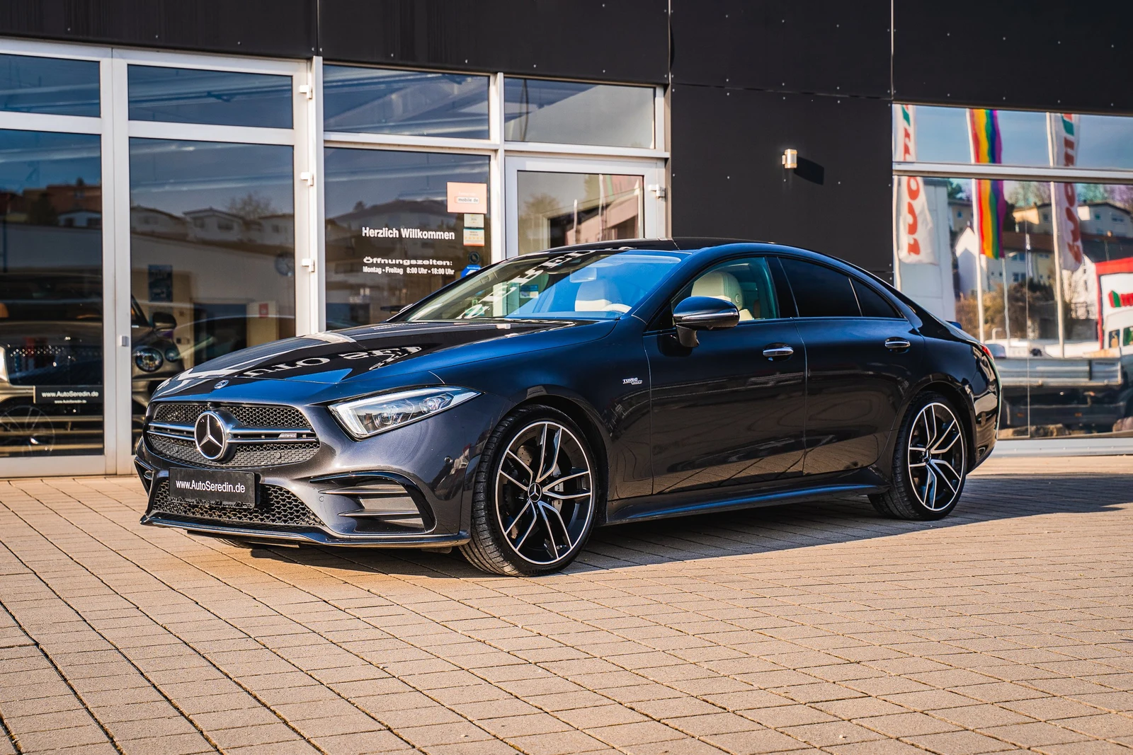 Gray Mercedes-AMG CLS 53, full front three-quarter view
