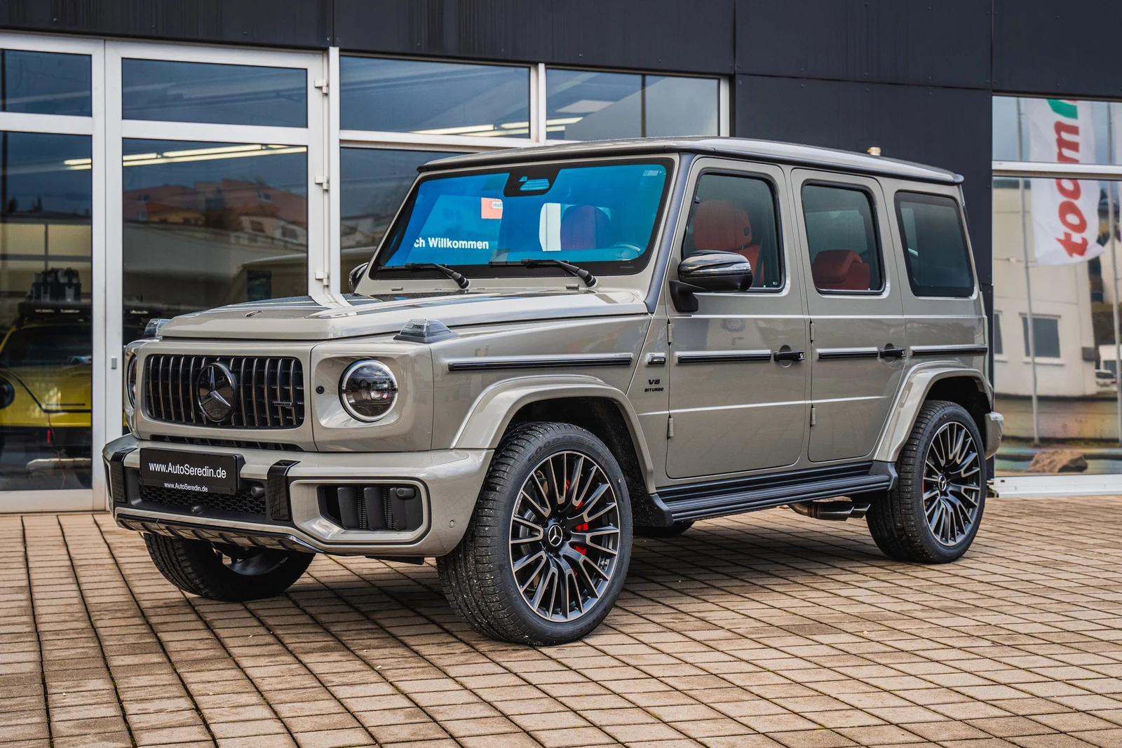 Gray Mercedes-AMG G 63, full front three-quarter view