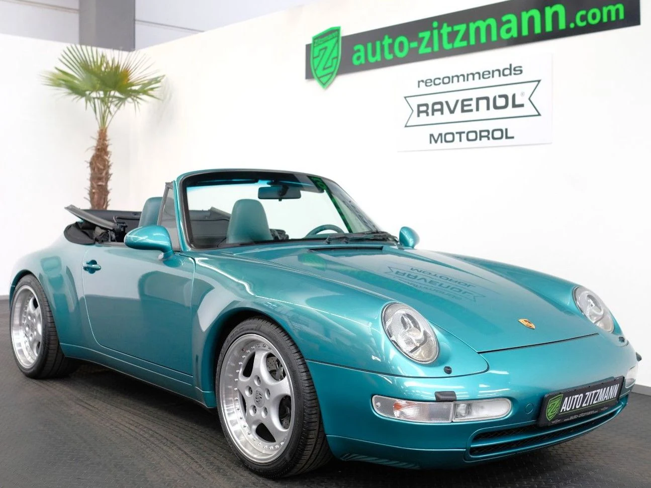Wimbledon Green Porsche 911 Carrera Cabriolet, front three-quarter view