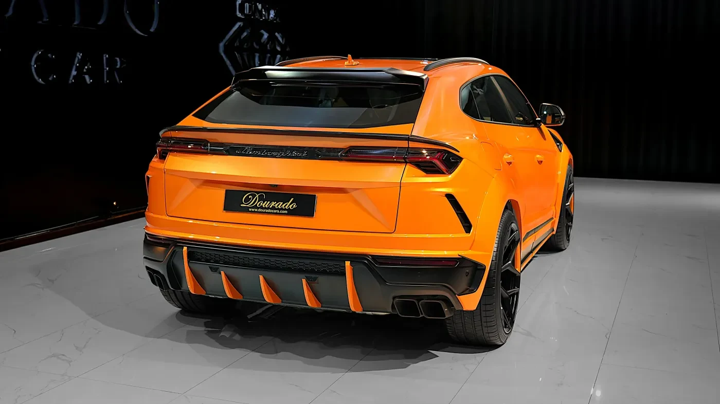 2023 Lamborghini Urus Novitec ESTESO, rear three-quarter view, Orange Arancio Borealis