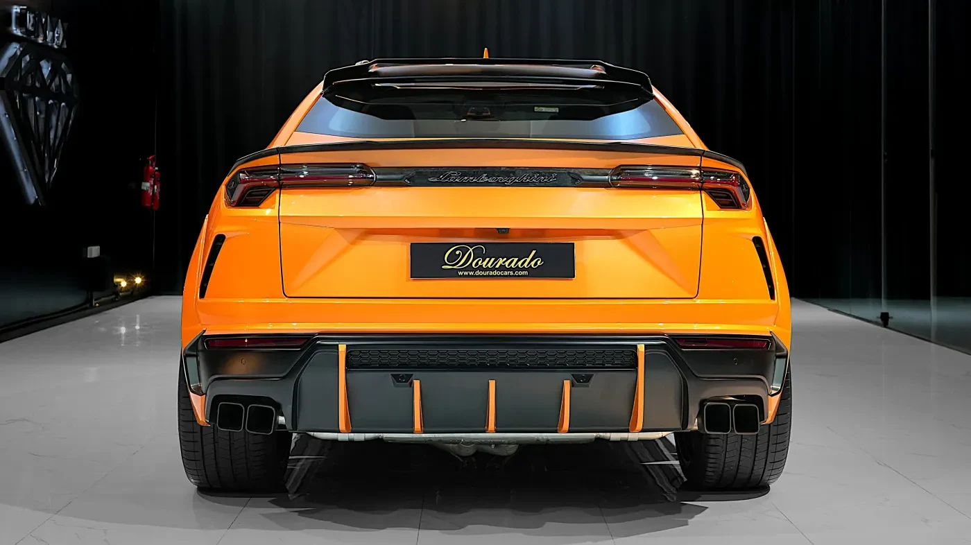 2023 Lamborghini Urus Novitec ESTESO, rear three-quarter view, Orange Arancio Borealis