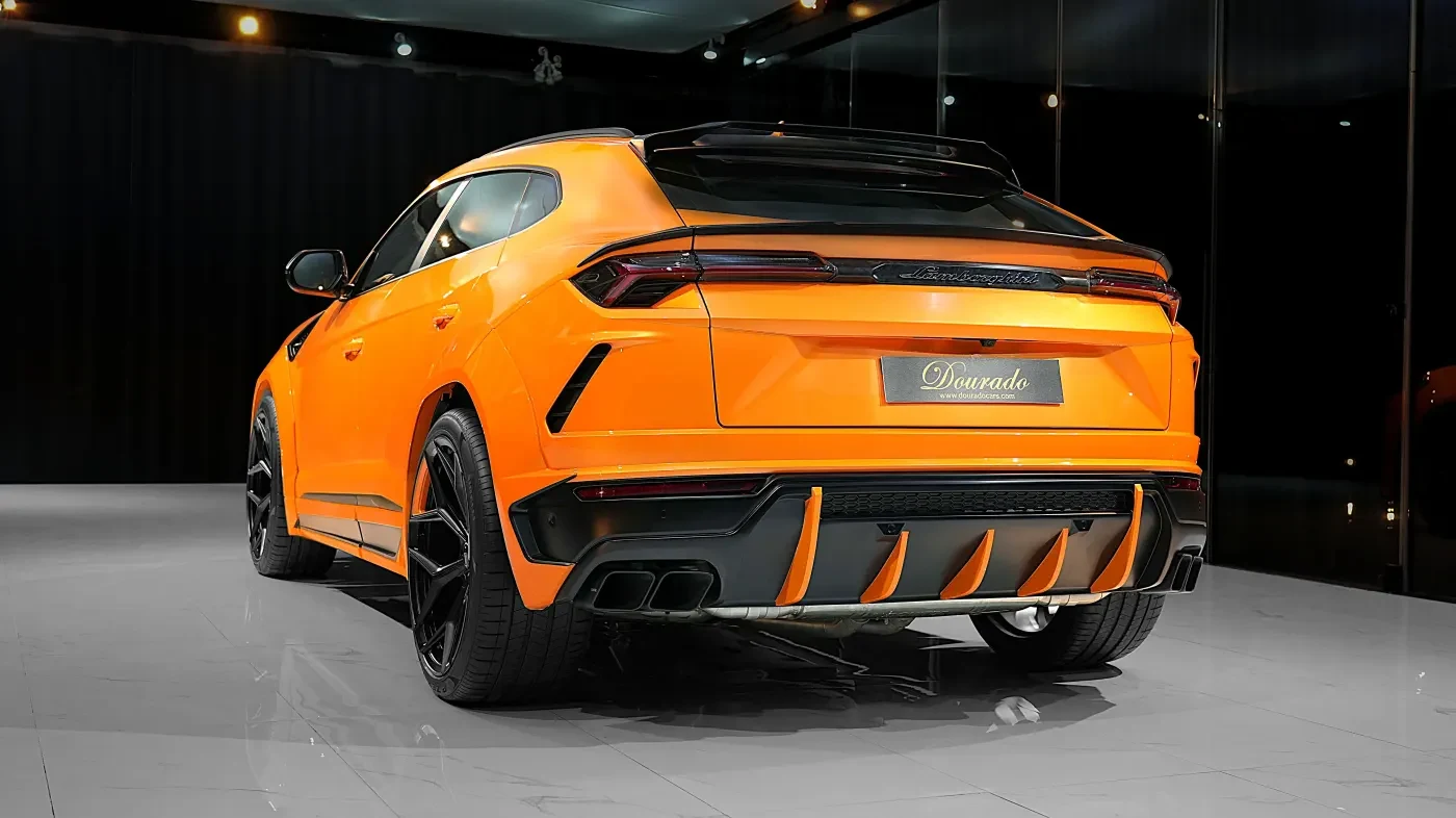 2023 Lamborghini Urus Novitec ESTESO, rear three-quarter view, Orange Arancio Borealis