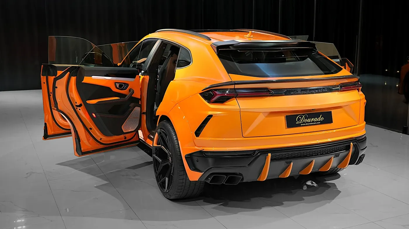 2023 Lamborghini Urus Novitec ESTESO, rear three-quarter view, Orange Arancio Borealis