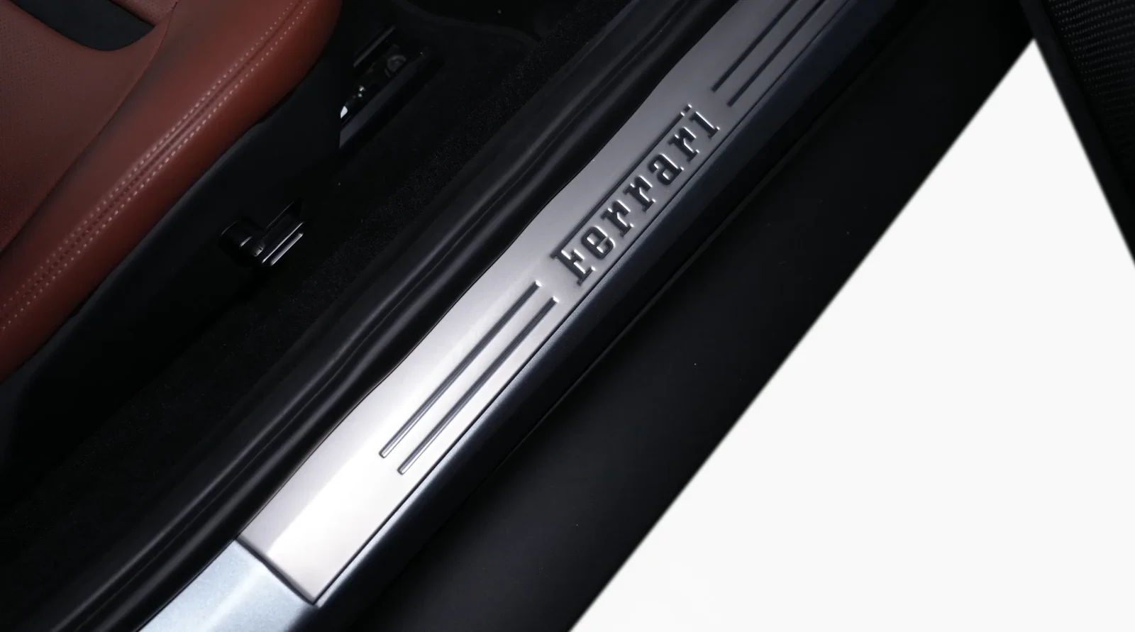 2023 Ferrari Roma interior, door sill, Terra Bruciata