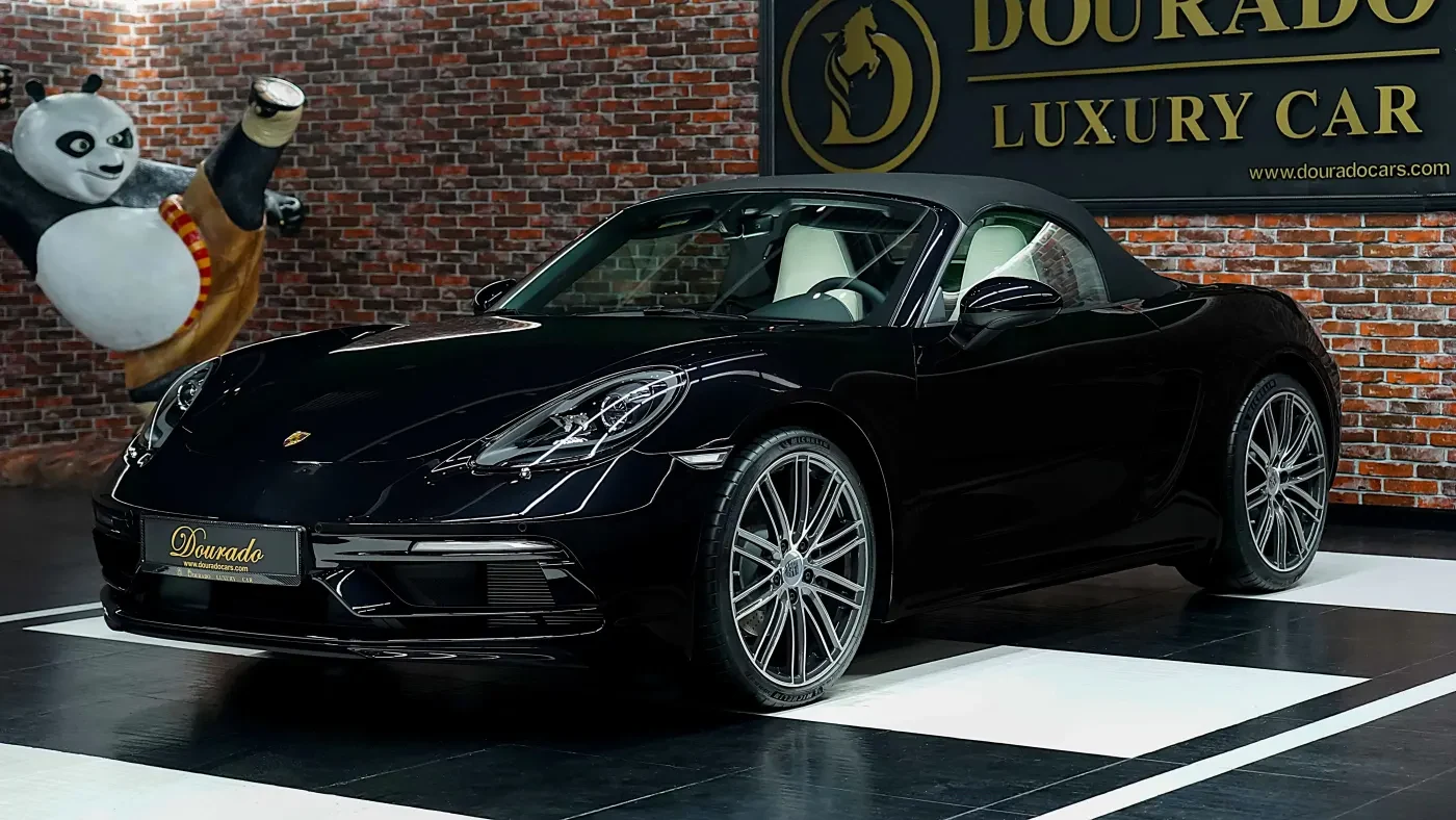 2023 Porsche 718 Boxster, Jet Black Metallic, complete car from a front three-quarter angle