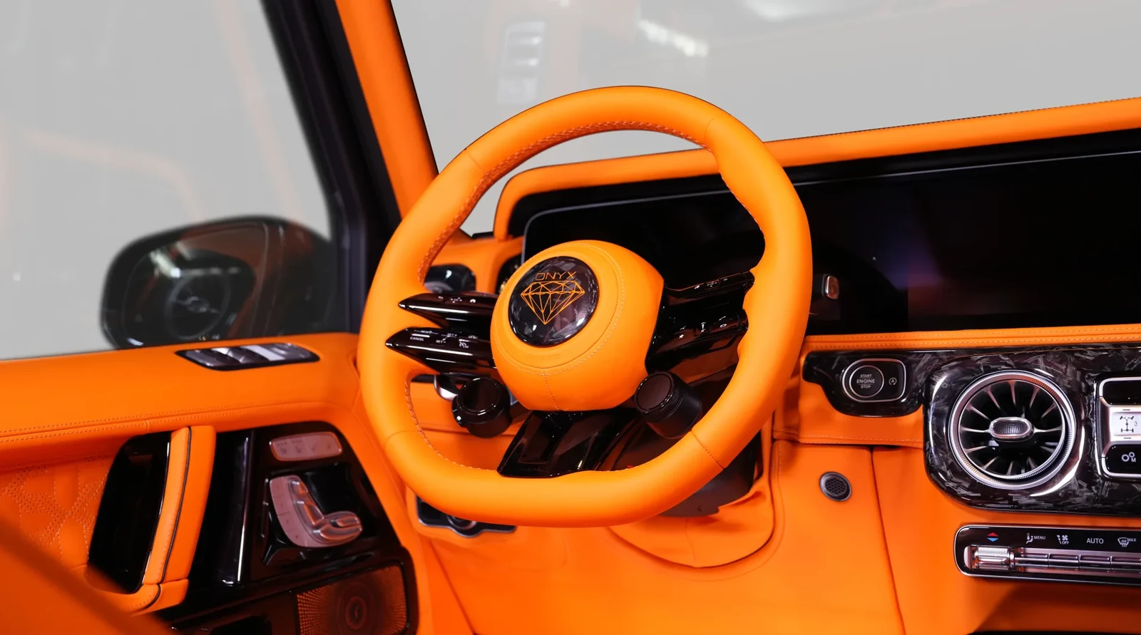 2025 Mercedes-Benz G-Class G8X Rage by Onyx Concept interior, steering wheel, Mandarin orange