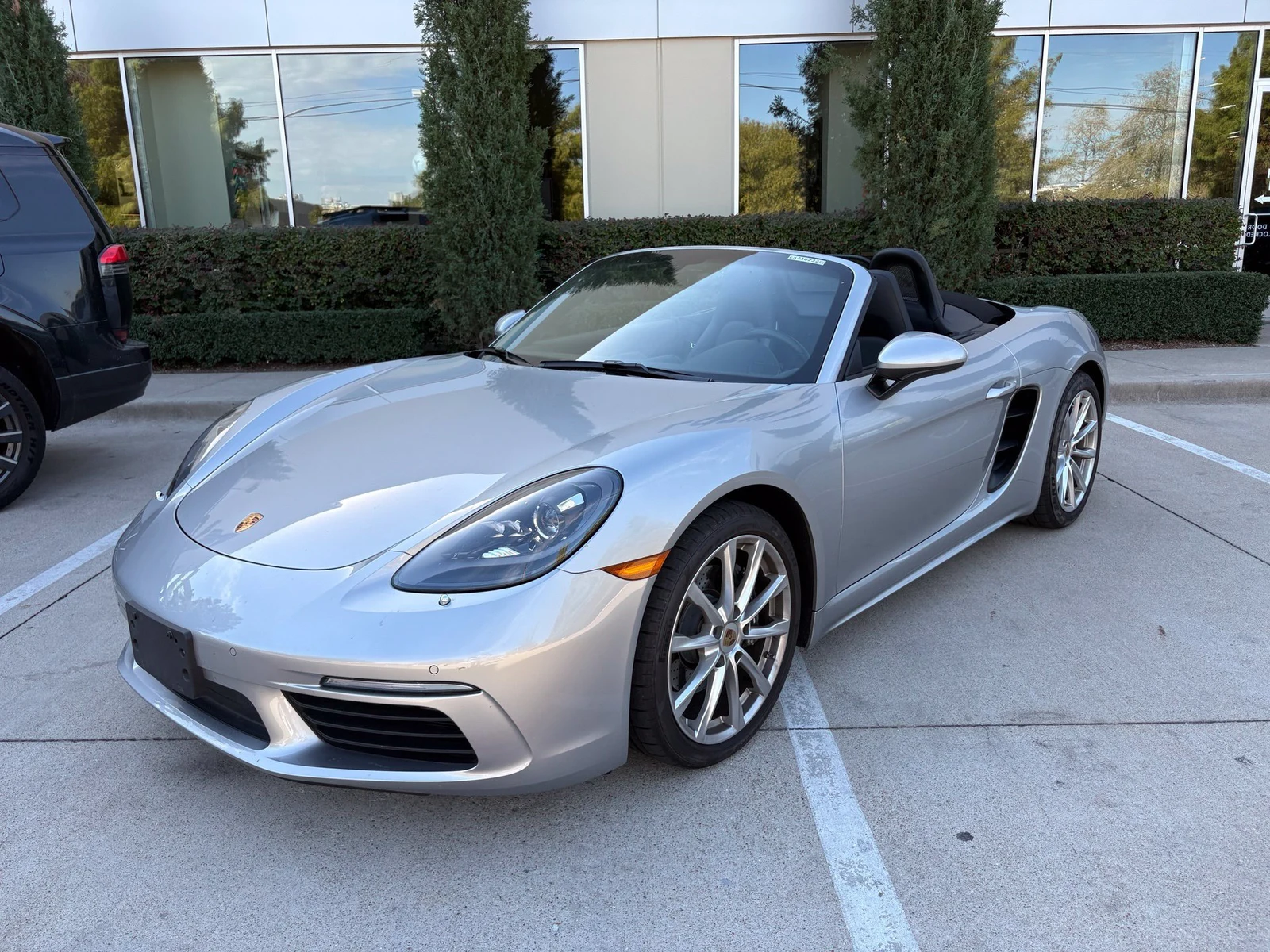 2021 Porsche 718 Boxster, GT Silver Metallic, complete car from a front three-quarter angle