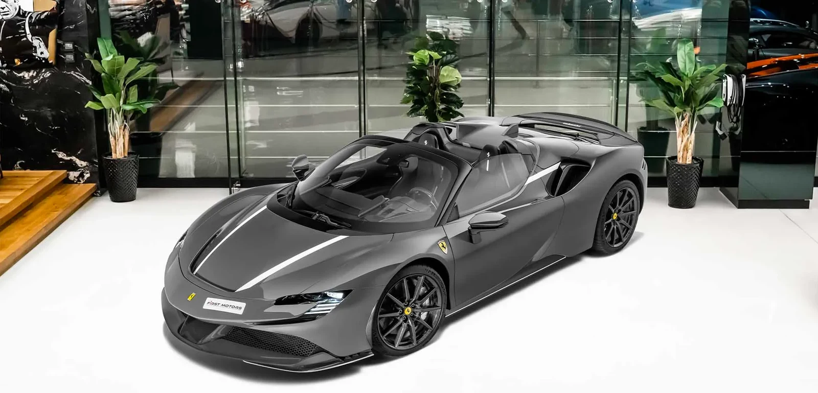 2023 Ferrari SF90 Spider in Grey with white accent stripes, front three-quarter view
