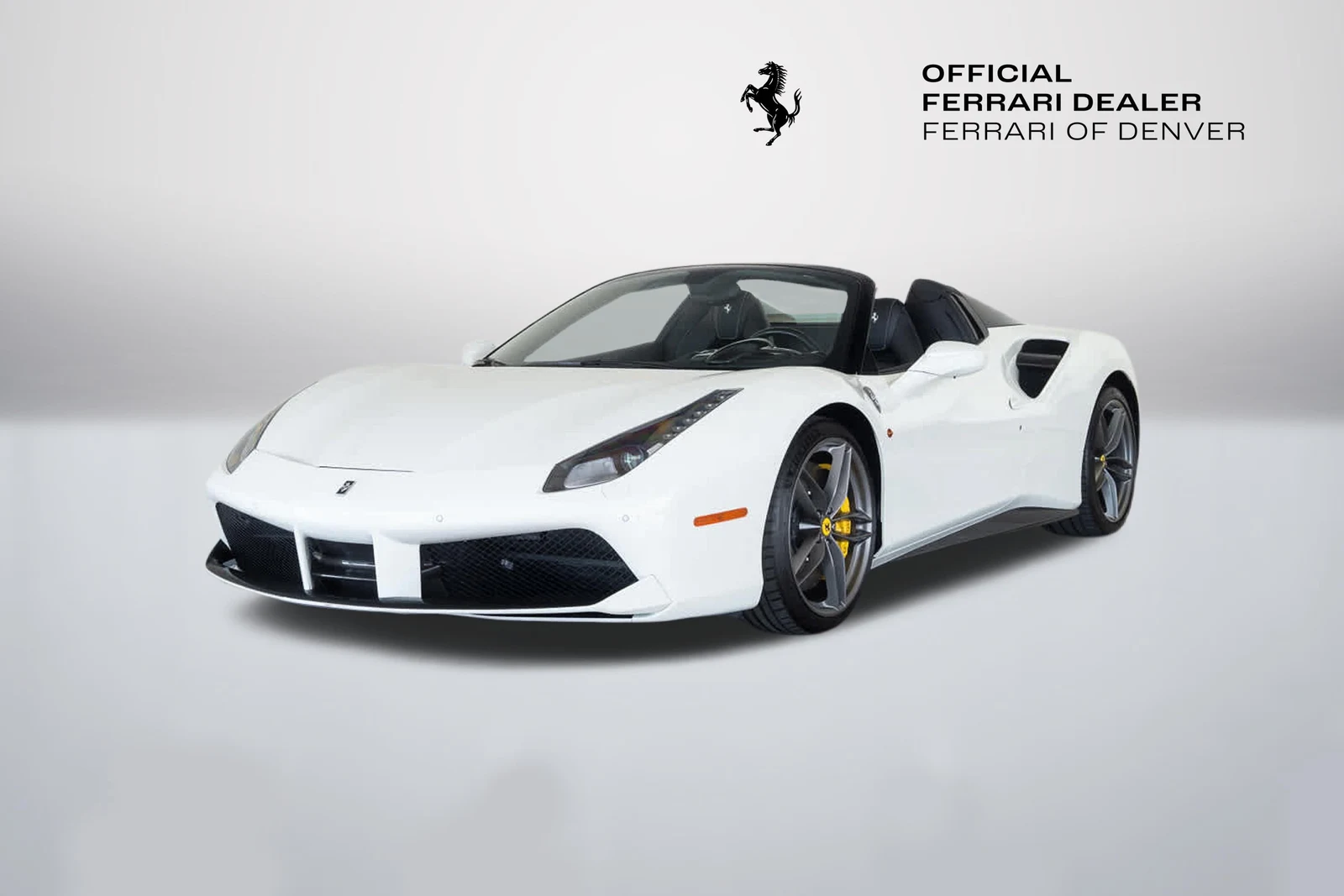 Bianco Avus Ferrari 488 Spider in a front three-quarter view