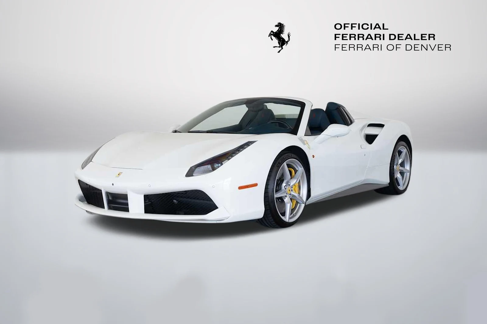 Bianco Avus Ferrari 488 Spider in a front three-quarter view