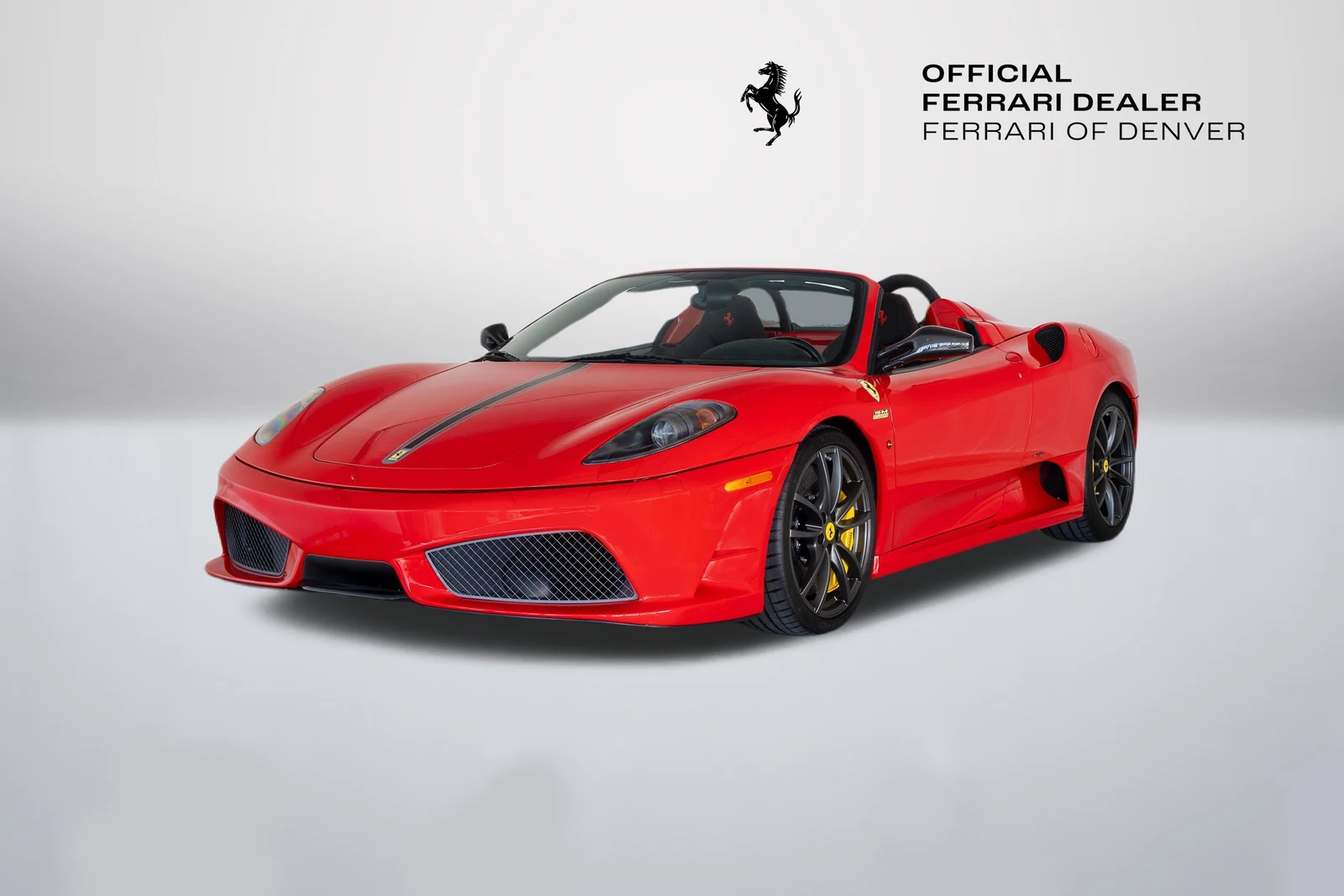 Rosso Corsa Ferrari Scuderia Spider 16M in a front three-quarter view