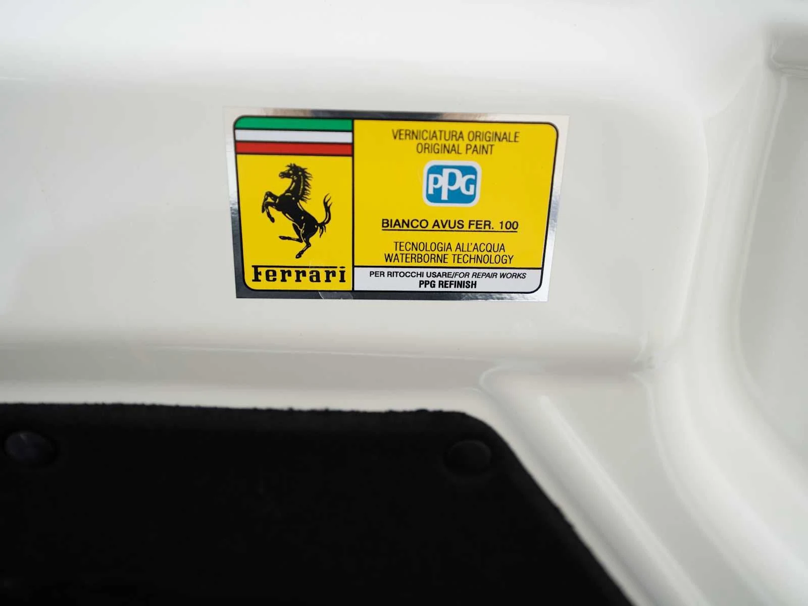 2022 Ferrari 812 GTS interior, door sill, Rosso Ferrari