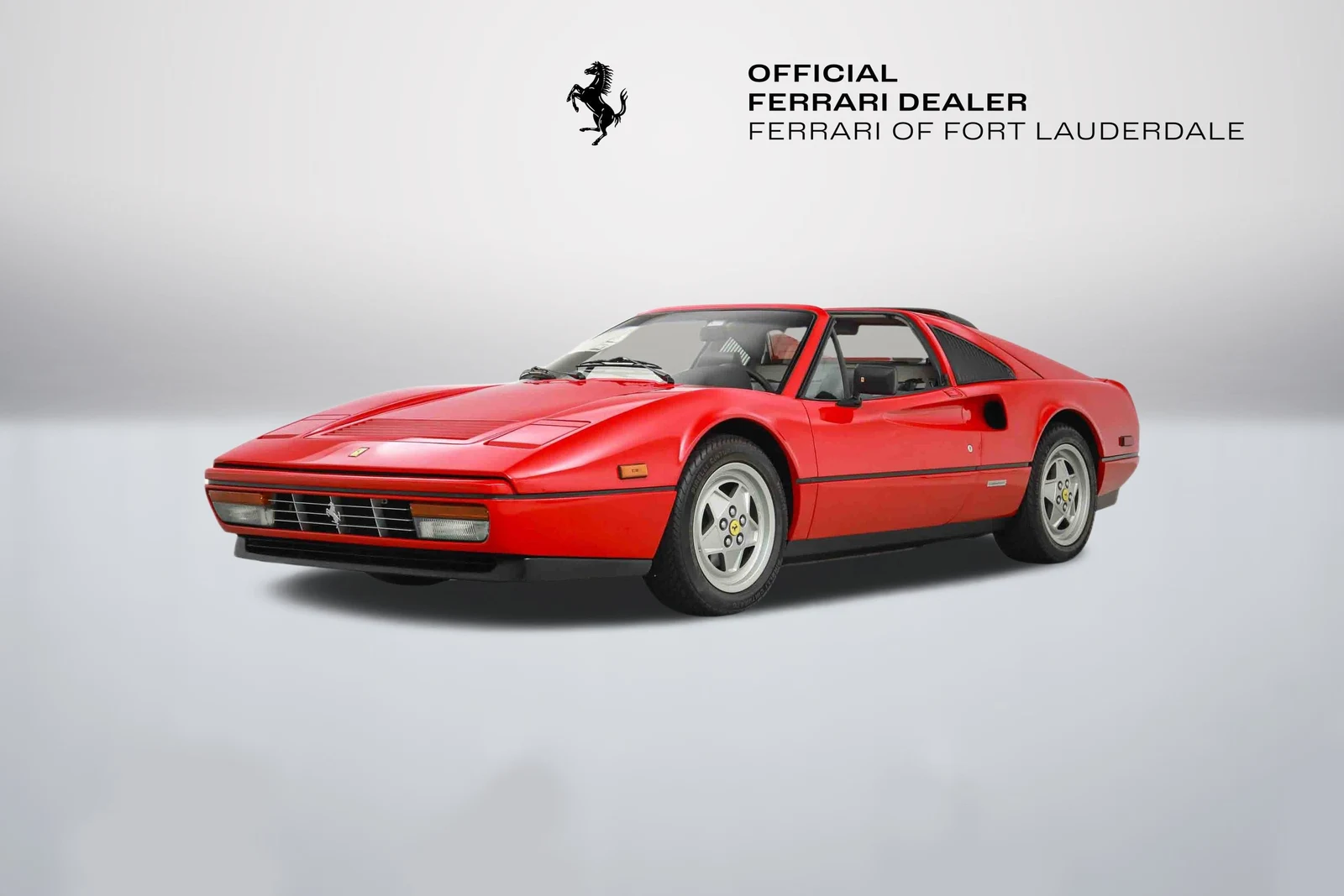 Rosso Ferrari 328 GTS in a front three-quarter view