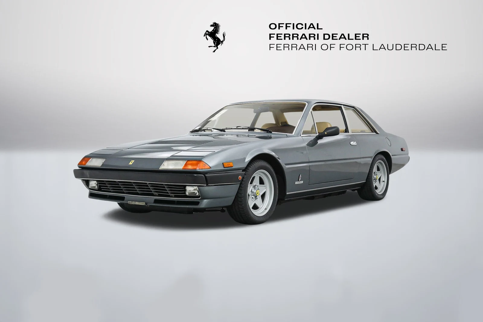 Grigio Ferrari 400i A in a front three-quarter view