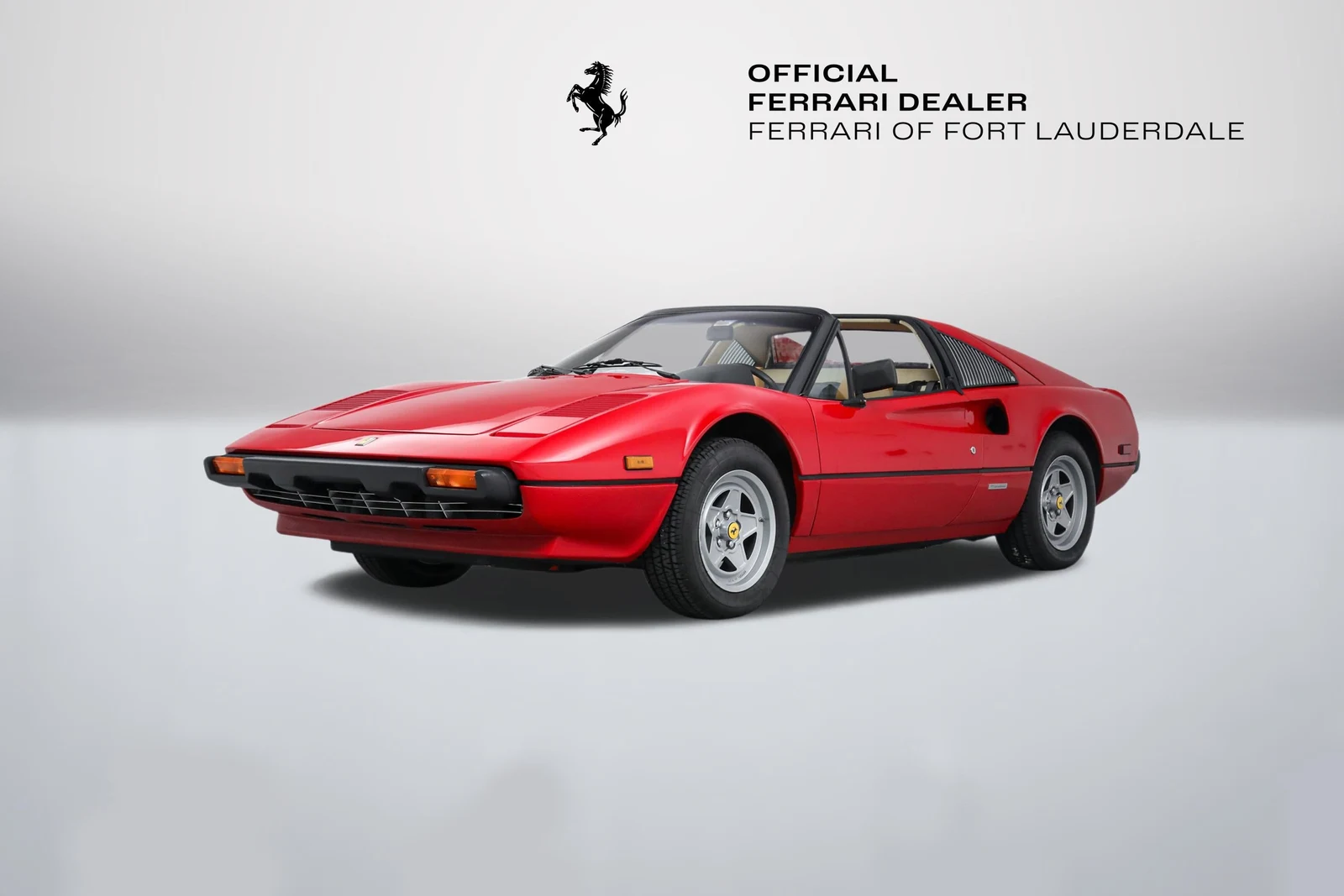 Rosso Ferrari 308 GTSi in a front three-quarter view