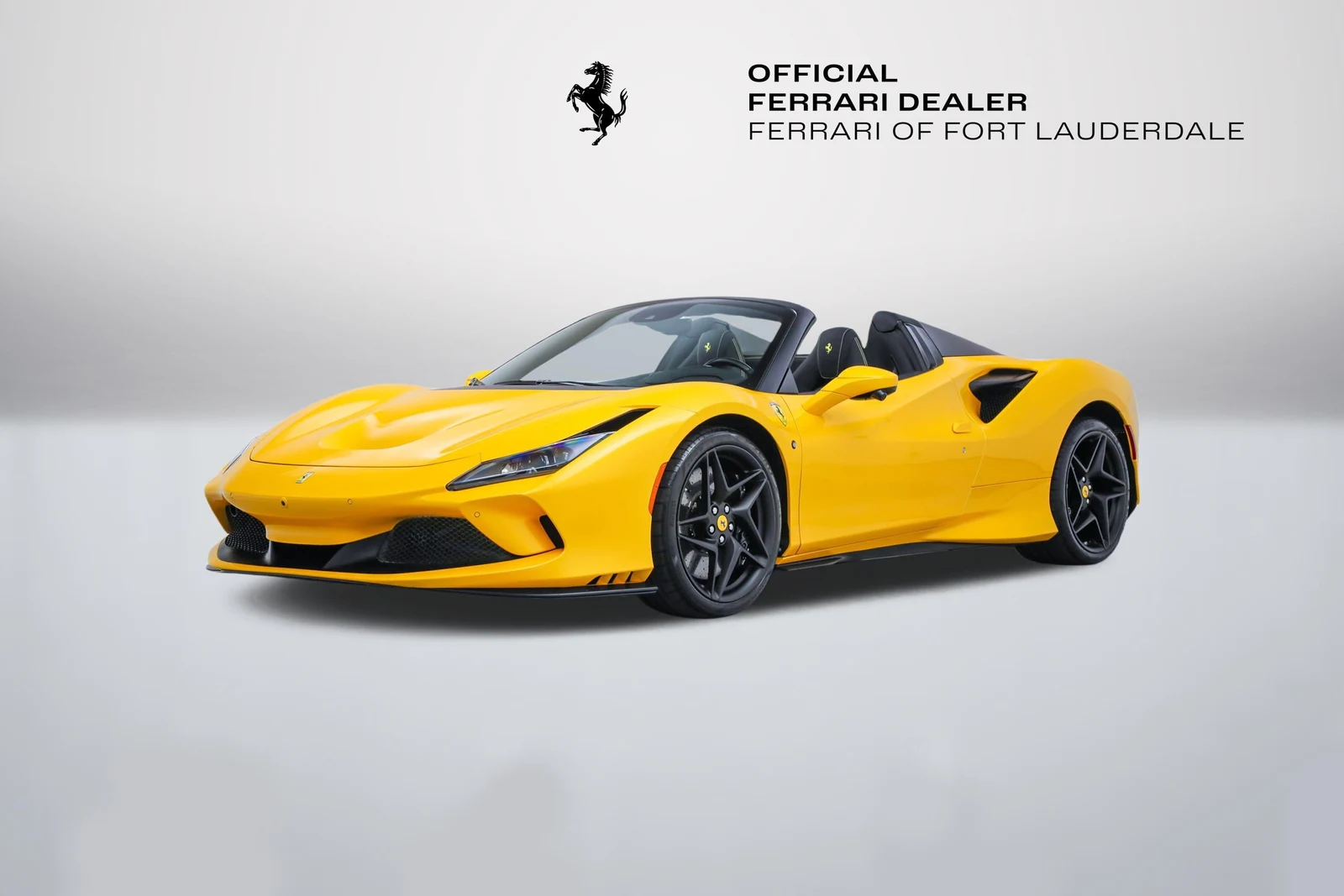 Giallo Triplo Strato Ferrari F8 Spider in a front three-quarter view