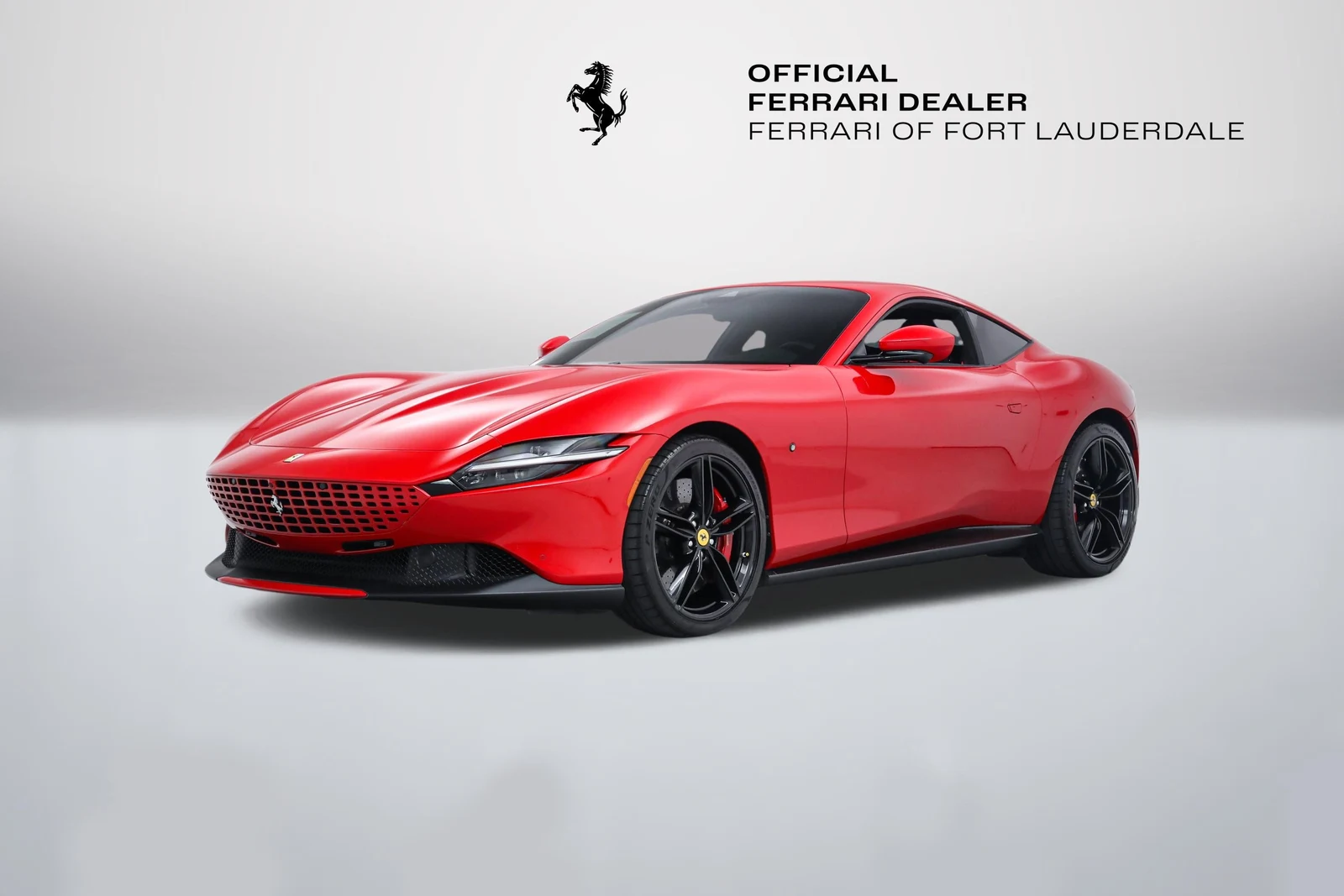 Rosso Corsa Ferrari Roma in a front three-quarter view